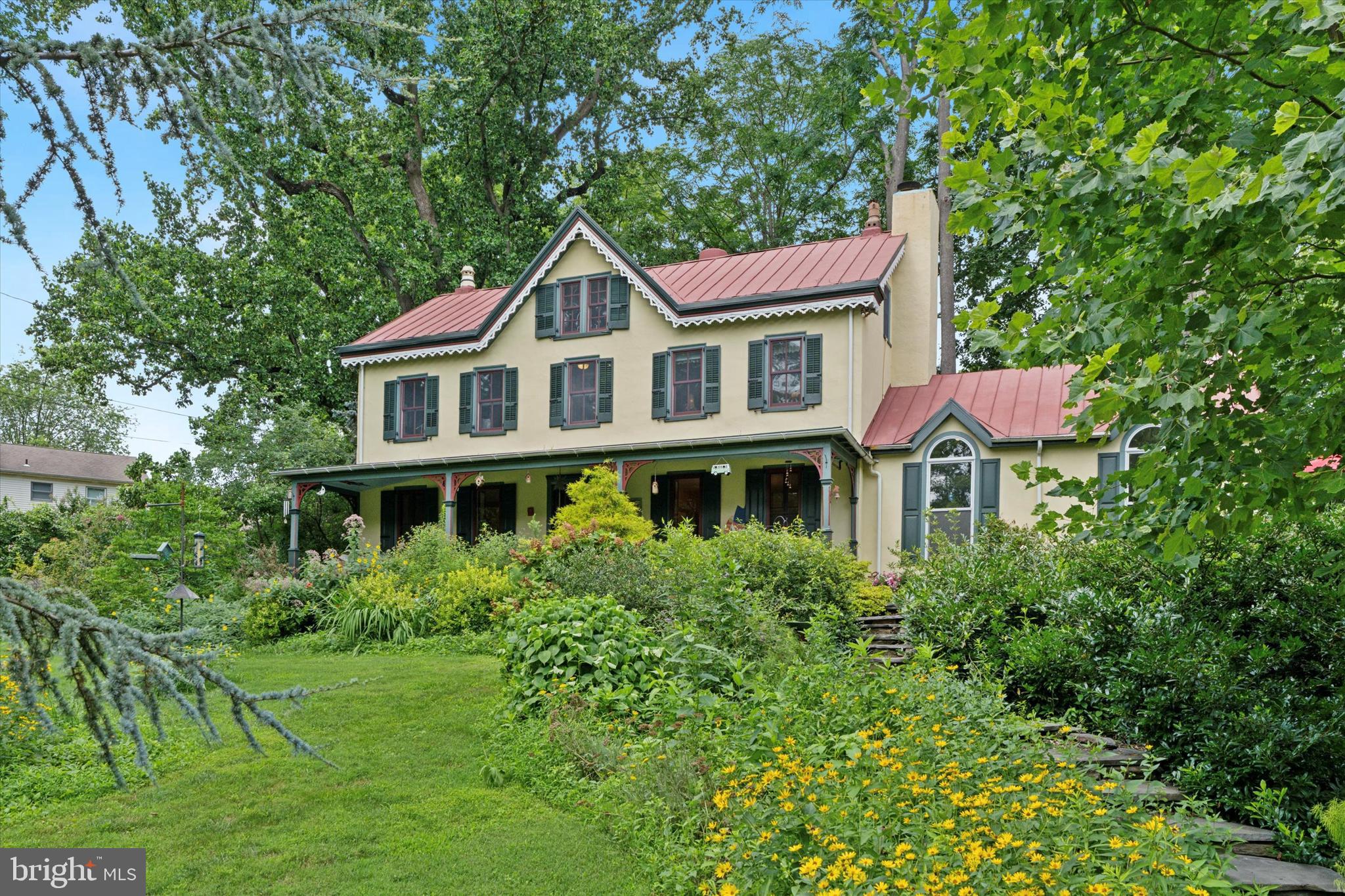 This distinguished circa 1840 stucco-over-stone Victorian Manor, set on 2.3 private acres, including 907 Florence Lane, offers picturesque views & comprehensive modern updates. The Southern-facing porch, with meticulously restored gingerbread details, provides a welcoming entry overlooking gardens featuring abundant native plants that support local wildlife & help preserve the watershed. Inside, find deep-set window sills, original random-width, old-growth hardwood flooring, & beautifully preserved period millwork. The updated kitchen features an exposed stone wall, a vaulted, exposed-beam ceiling with skylights, custom Cherry WoodMode cabinetry, granite countertops, & a central island. A breakfast nook opens onto a private patio, perfect for relaxed mornings or al fresco dining. Ample pantry storage & an adjacent mudroom/laundry with a powder room add convenience. The living room includes a wood-burning fireplace. A double-sided gas fireplace connects to the family room & the dining room. This expansive family room extends to an elevated mahogany deck overlooking the private heated pool. The primary suite features an en-suite marble bathroom with dual vanity, claw-foot tub, & frameless glass shower. Two additional second-floor bedrooms share a well-appointed hall bath with a whirlpool tub. High-efficiency, period-correct custom windows allow abundant natural light. The 2005 third-floor addition by Hanson Fine Building & Restoration comprises two large bedrooms & a shared full bathroom. These rooms feature custom reproduction millwork designed to complement the original details, with energy-efficient windows. Renovations prioritized craftsmanship & lasting quality, integrating modern innovations while preserving the home's original character. Key updates include a 6-zone Buderus natural gas condensing boiler for radiant floor & baseboard heating, as well as a three-zone central air conditioning system. A 2022 Generac 22 kW whole-house natural gas generator provides reliable backup power with a dedicated service line. The property's 2.3 partially wooded acres feature four distinct outdoor living areas: a private breakfast patio, a full Southern-facing front porch, an elevated family room deck, & a timber-framed pool gazebo with a gas barbecue grill island. The heated in-ground pool has decorative faux stone plaster, custom tile, a deep end, & a hardscaped deck area. An Audubon-registered Bird Friendly Property, it offers a serene natural setting ideal for gardening. A metal roof RV carport (roof only) provides protection for recreational vehicles. An adjacent Amish-built garden shed from Lancaster, PA, offers natural light for potting & ample storage for outdoor equipment, with 110 underground electrical service. Strategically located, this home offers convenient access to the PA Turnpike & the Blue Route, major metropolitan business centers & premier shopping, including The King of Prussia Mall. Everyday amenities, such as Whole Foods, Giant, Lowe's & Target, are within 2 miles, with BJ's, Home Depot & IKEA approximately 2.8 miles away. Wings Field LOM: A private, public-use general aviation airport, 2.4 mi away, accommodating private/corporate flights/helicopters. Charming Local Areas: Explore Chestnut Hill 3.6 mi, Conshohocken 4 mi, Ambler 5 mi, Devon Wayne 11 mi. The Schuylkill River Trail is 1.5 miles away, linking the Philadelphia Art Museum & Valley Forge, & connects to the Cynwyd Heritage Trail, both of which offer walking/biking paths. Wissahickon Valley Park, 4 miles away, provides over 50 miles of trails for hiking/running/biking/horseback riding. Convenient access to independent schools: Plymouth Meeting Friends & Germantown Academy, to the esteemed Villanova University, Haverford College & the University of Pennsylvania, with many other excellent options nearby. This location offers convenient access to a wide array of golf courses, including public links & championship clubs.