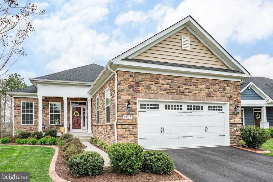 Nestled within the prestigious 55 and over adult community of Virginia Heritage at Lee's Park in Fredericksburg, Virginia, this exquisite residence offers a lifestyle of luxury and relaxation.  Situated in a mastered-planned community with a  gated entrance, residents enjoy an array of amenities designed for ultimate comfort and convenience. <br< <br>

Key Community Amenities:
 - Fitness and Recreation:  Stay active and socialize with access to a fitness center, aerobics studio, indoor and outdoor pools, tennis and bocce ball courts, and a scenic walking and biking trails.
-Clubhouse Delights: Embrace leisurely pursuits in the clubhouse's library area, card room, arts and crafts areas, woodworking shop and spacious ballroom perfect for social gatherings.
- Serene Surroundings:  Discover peaceful areas in the clubhouse and throughout the community to read chat with neighbors, or simply enjoy the natural beauty of the surroundings. <br> <br>

The Residence:
This elegant Lennar Avon homes, just shy of four years old, offers a serene and private view of wooded area.  Adorned with stone and vinyl siding, the exterior features an irrigation system and landscaped shrubbery and flowering plants. <br> <br>

Luxurious Interior Features:
Platinum Package Upgrades:  Enjoy engineered wood flooring throughout  the living room, dining area, kitchen, and primary bedroom, showcasing the home's aesthetic and easy maintenance.   Notice the decorative  crown molding throughout the lst floor.   Other upgraded features include upgraded granite, upgraded backsplash in gourmet kitchen as well as primary bath, recessed lights in primary bedroom, living room, foyer and finished basement.   There are  Tray ceilings in primary bedroom, foyer, living room and dining. area, fans with lights are in living room and three bedrooms.  Engineered  hardwood  floors for the all the  first floor rooms except for 2nd bedroom which has carpet and baths having tile floors.   Ceilings are 9ft throughout the house.  <br> <br>

Gourmet Kitchen:  
The upgraded kitchen boasts granite counter tops, a stylish backsplash, and GE Profile Appliances including double oven, French door refrigerator, built-in microwave and glass gas cooktop.  The kitchen island, featuring shiplap  detailing, offers additional seating and functionality.  <br> <br>

Tranquil Primary Suite: 
 Retreat to the spacious primary bedroom with its tranquil views, recessed lighting, ceiling fan, and access to the porch.  The adjoining primary bath features an oversized shower, granite countertops and tiled floors.  <br> <br>


Flexible Living Spaces:  
The home offers versatility with a second bedroom and a third bedroom/flex room, ideal for use as a home office or dining room, each offering comfort and functionality.  Your choice!
Finished Basement:  Descent the carpeted stairs to discover a spacious walkout  finished basement with rough in for potential wet bar sink, complete with recessed lighting,  French doors and a full Bath.   Additional unfinished space provides ample storage or customization options. <br> <br>

Additional Features:
All mechanical systems have been recently serviced ensuring peace of mind for the new homeowner (Invoices available).  Customer Window treatments:  Enjoy the added elegance and privacy of custom faux white wood blinds throughout the home. 

Cozy Living Spaces:  
Relaxing  in the open  living area featuring a cozy gas fireplace, decorative tray ceilings and recessed lighting,  perfect for gatherings or quiet evenings at home.  <br><br>

Shopping and Fun:  
Many groceries, banks, car repair, restaurants,  general shopping, VRE Train going north and south, hospitals, movies , parks etc.  And of course, a historical City of Fredericksburg full of character is inviting.  
Don't miss this opportunity to experience living in one of Fredericksburg's premier adult communities.  Schedule your showing today and make 9830 White Oak Swamp Court your new sanctuary.