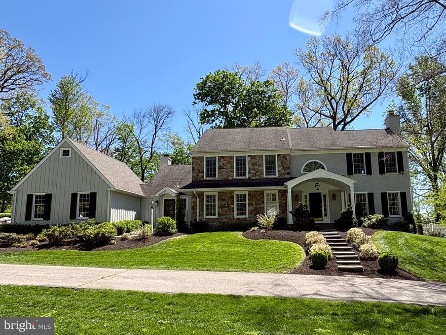Welcome to 725 S Roberts Road, Bryn Mawr located in award winning Radnor Township, nestled peacefully down a long driveway. As you step inside the entry foyer, you're greeted by beautiful hardwood floors that flow seamlessly throughout, adding warmth and charm. The formal living room, featuring a wood burning fireplace, sets the tone for the home's elegance, providing a perfect space for relaxing and entertaining. Adjacent to the living room is a formal dining room with a large bay window that fills the space with natural light, creating the perfect atmosphere for dinner parties and family gatherings. The spacious eat-in kitchen has custom cherry cabinetry, granite countertops, center island, as well as an eat-in area. The kitchen flows effortlessly into a large, light-filled family room with vaulted ceilings, gas fireplace, custom built-ins, and a custom bar area perfect for your entertaining needs. Just off the kitchen you'll find a newly renovated mudroom/ laundry room equipped with radiant heat flooring and plenty of storage for your daily convenience. For those who need a quiet space to work, there is a private office on the first floor featuring built-in bookcases throughout. The first floor is completed by a newly renovated powder room and a large 2 car garage. Upstairs, the lovely primary suite serves as a tranquil retreat with a newly renovated primary bath and a custom built walk in closet. The three additional bedrooms are serviced by a newly renovated full bath in the hallway featuring bright white tile and cabinetry. The large, finished lower level is appointed with a seating area, bonus room and a full bathroom. Outside, the home sits on a sprawling one acre lot, with a lush private backyard featuring a natural bluestone patio. The backyard offers endless possibilities for outdoor living. You do not want to miss this spectacular property in Radnor Township!