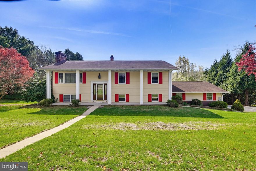 Welcome to 603 Yorkminster Ct, a spacious split foyer home offering versatile living and beautiful rustic touches.

The main level features a bright and expansive living room highlighted by a cozy pellet stove and gleaming hardwood floors that flow throughout the main living areas. The open dining space seamlessly connects the living room to the kitchen, which is equipped with stainless steel appliances, abundant cabinetry, and ample counter space. Just off the dining area, a sliding glass door leads to a large deck spanning the full length of the home—perfect for entertaining or relaxing while overlooking the expansive backyard. Fresh paint throughout enhances the open space, creating a warm and inviting atmosphere.

Down the hall, the primary bedroom offers a spacious retreat with a large built-in wardrobe, a private en-suite bathroom featuring a walk-in shower, and direct access to the deck through its own sliding glass door. Two additional bedrooms provide flexible options for guest space, home offices, or additional living areas. A full hall bathroom conveniently situated between the rooms completes the main level.

The lower level provides exceptional flexibility, featuring a separate living space complete with a second kitchen outfitted with a full-size refrigerator and oven, along with its own dining area. A large den with a wood stove creates a warm and inviting atmosphere, ideal for a family room or guest suite, with access to a full bathroom and the backyard patio beneath the deck. Additional highlights include another family room off the main stairwell and a laundry room with exterior access.

The attached two-car garage offers direct access to the lower level, making daily routines and unloading a breeze. With over 500 square feet of space, there is ample room for multiple vehicles, storage, or even a workshop setup. Recent updates include fresh paint throughout the main floor, as well as an updated septic system in 2024, and a new sliding glass door on the lower level. 

Ideally located in Carroll County, this home offers convenient access to a variety of sought-after local amenities and destinations. Enjoy outdoor recreation at nearby Piney Run Park, featuring scenic trails, fishing, kayaking, and picnic areas, or explore the charm of downtown Westminster, home to local boutiques, restaurants, and seasonal events. Everyday conveniences are just minutes away with shopping and dining options at TownMall of Westminster, along with popular retailers, grocery stores, and services nearby. Commuters will appreciate easy access to MD-140 and MD-97, providing a smooth connection to Baltimore, Frederick, and surrounding areas.

This location perfectly blends peaceful suburban living with accessibility to everything you need.