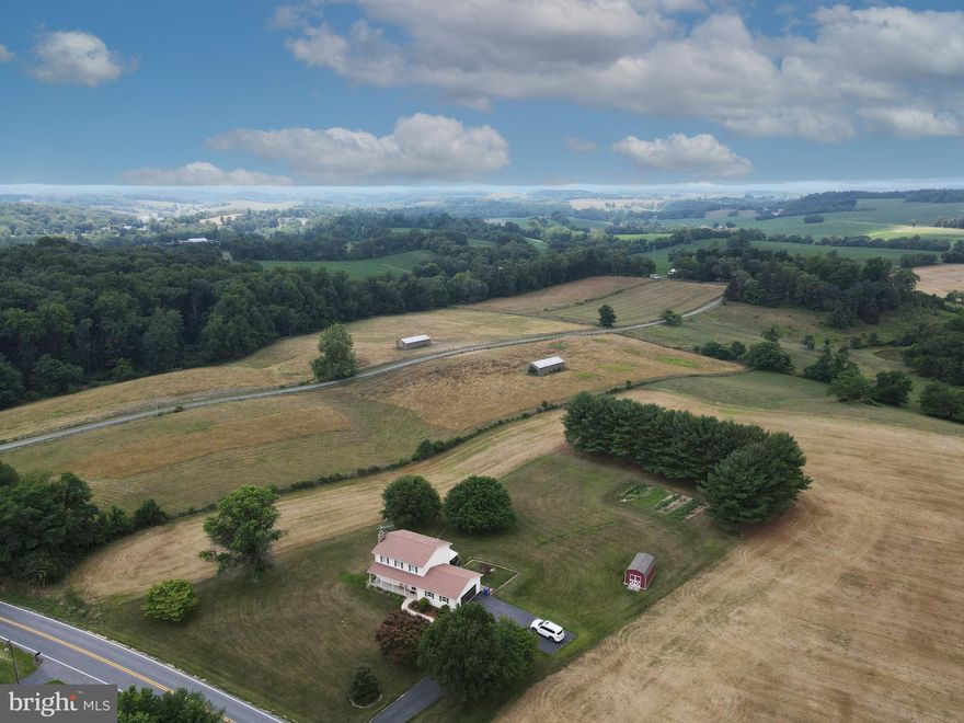 Immaculate Home in the Country, surrounded by farmland with a beautiful panoramic view! 3 Large Bedrooms on Upper Level with a Full Hallway Bathroom with Tub Shower. Owner's Suite has an attached Full Bathroom with a large Stall Shower. Main Level has Living Room with a Gas-Log Fireplace, Dining Room, Half Bath & Country Kitchen with a Sunroom off the rear. Access to the 2 Car Garage is through the eat in dining area in the kitchen. Lower Level features a large Family/Rec Room with a Wood Burning Stove Fireplace. Separate utility and laundry room with storage area. Walk out to the hardscape patio in the backyard. Enjoy the 1.5 acre country property that has a row garden already started in the backyard!  Small Fenced in area off the Sunroom.  Covered Front Porch. Pets Case by Case - please get them approved before making an application, no cats. $250 non-refundable pet deposit.  Tenants responsible for lawn care, trash and all utilities. Available now. Use the "Click Here to Apply on Line" link to make direct application via Bright or use the link in Agent Remarks.