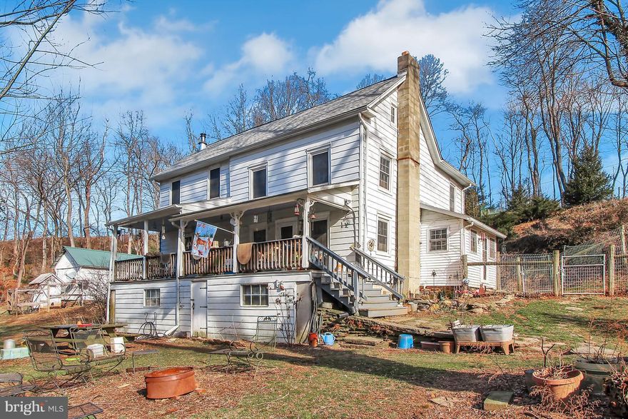 This 12+ acre farmette has updated kitchen, first floor laundry, first floor full bath and hardwood floors. Outbuildings include a barn, workshop, over-sized detached garage, wood shed and chicken coops. Located on a very lightly traveled, paved road it is quiet and peaceful, but just 5 minutes from Kennard Dale High and Fawn Elementary schools.A year-round stream runs through the property and running water can be heard from the spacious front porch.  There is a welded wire and wood post fence out the back door for your dogs. Property is mostly wooded, but could easily accommodate horses. Wood stove heats entire home but boiler is new if you prefer. Newer windows and roof on home.