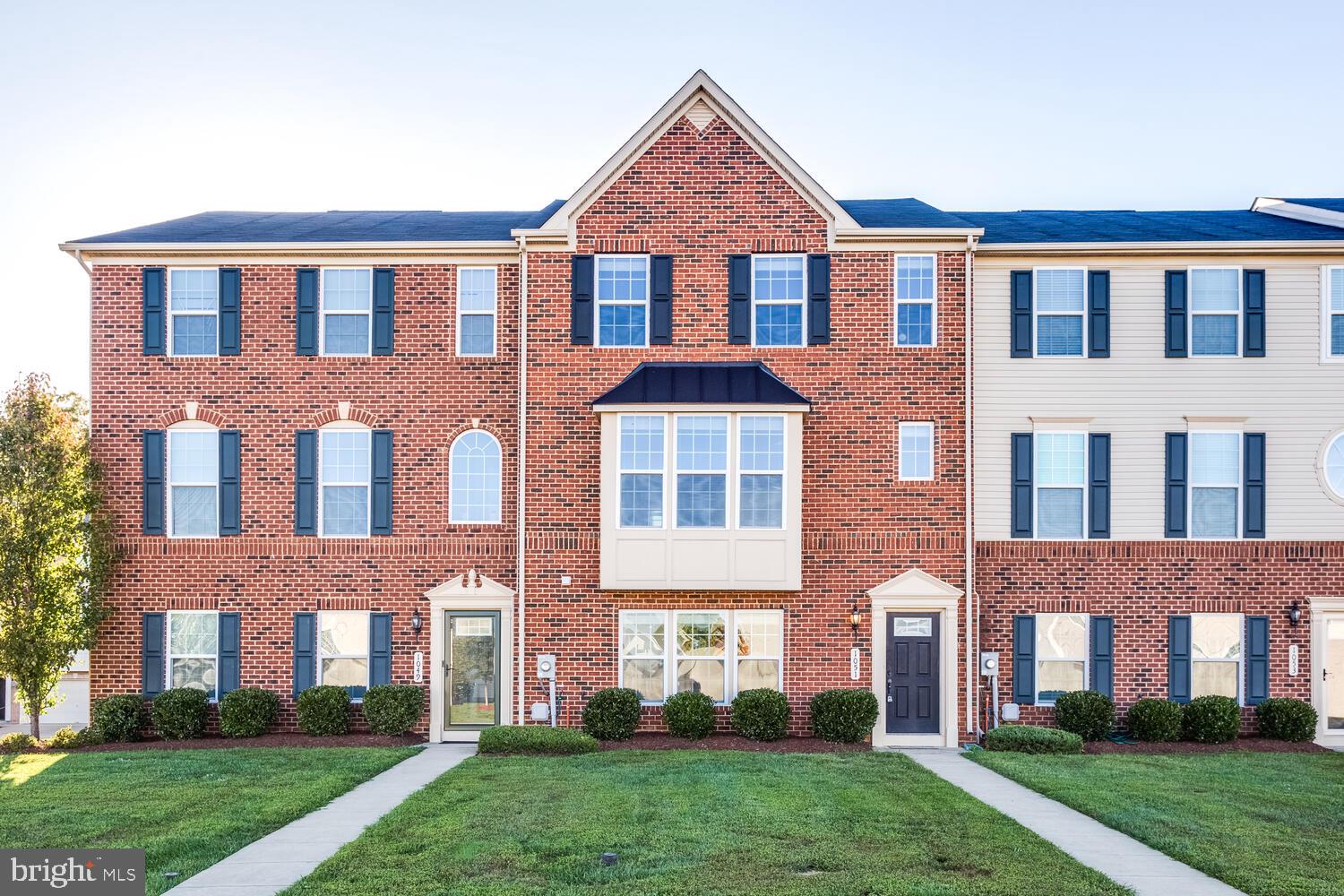 100% USDA financing available for eligible buyers! Beautifully maintained townhouse in close proximity to schools, shopping & restaurants! Freshly painted & all new carpet just installed Sept 2020. This home features 4 bedrooms, 2 full & 2 half baths. Upgraded kitchen to include hardwood throughout, cabinets with pull out shelving, granite counter tops, backsplash, stainless steel appliances, and a large kitchen island with additional cabinets. Kitchen is open to large dining area and also features two pantries. Large family room off kitchen with surround sound. The primary bedroom has a huge walk-in closet, an additional closet with built-in closet organizers, and a large upgraded bath with separate shower & soaking tub. Two car rear entry garage with plenty of additional parking in the driveway and behind the house which backs to woods. Lawn is maintained by the HOA. Call today to schedule a tour of this beautiful home!!