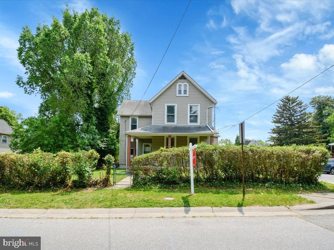 Gem of a home in quiet historic Cedmont neighborhood experiencing new life and loving restoration. Currently set up as two units but could be reconverted to a single-family home. First floor features large living and dining rooms with new flooring, bedroom with newly refinished floor, kitchen, and 3/4 bath. Newly painted and carpeted second floor has two bedrooms, eat-in kitchen, and 3/4 bath. Perfect for adult independent unit. This house offers a large unfinished basement and laundry area, gas heat, central air (2 zones), a covered front porch, back deck, and big, flat back yard. This property also includes five on-street garage units with electricity that are detached from the home and currently rent at $80 a month each. Easy access to mass transit and a short distance to Rt. 1, I-95, and 695. NEW PHOTOS COMING SOON For Unit 1.