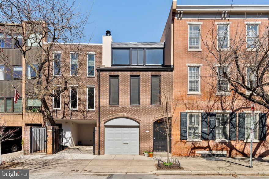 Opportunity Knocks!!!  Make this your dream home on a magnificent 17 by 90 lot located in the heart of Queen Village!!!  Featuring roughly 2,400 square feet this three-story mid-century modern residence offers enormous rooms throughout, an exquisite outdoor garden and ONE CAR GARAGE PARKING. The first floor features an open kitchen, dining, and cozy den, plus a powder room just off the entry foyer. Located off the den is a spectacular outdoor garden, surrounded by amazing, oversized trees. A slice of your very own private oasis!  Perfect for entertaining, the second floor offers a sprawling bright living room with a wet bar and large windows overlooking Monroe Street to the South. Completing the second floor is the incredibly spacious primary bedroom suite. There are two additional bedrooms, one full bathroom, and laundry room on the third floor. Don’t miss your chance to live in this true Queen Village gem, located in the desirable Meredith catchment school district! Sold "as is"