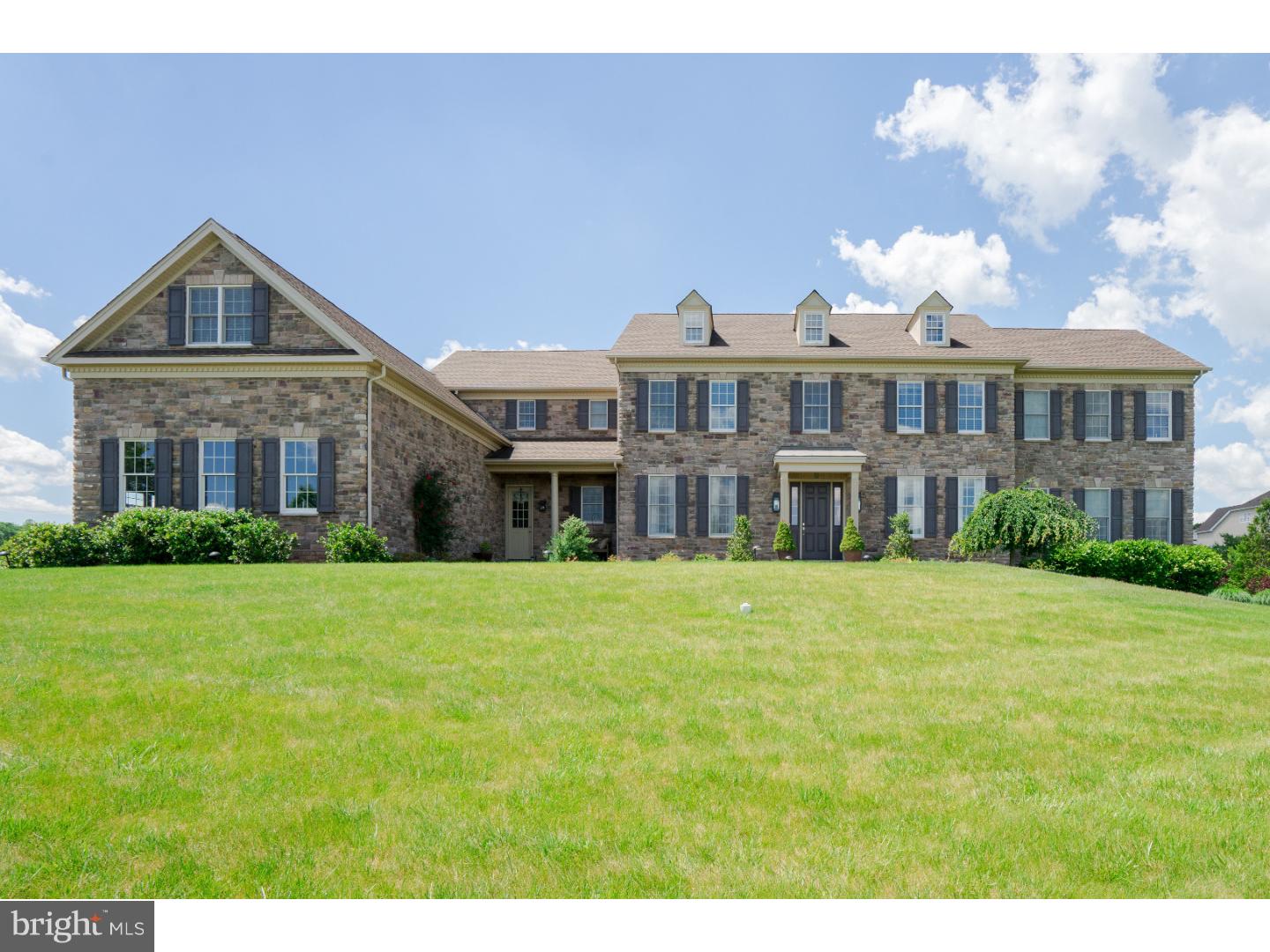 Professionally decorated and upgraded throughout, this magnificent home in Dutchess Farms will be sure to impress. Many luxury amenities including an in-ground pool with marble decking, waterslide, spa and waterfall. The ultimate in outdoor entertaining, there is also a covered terrace with pine ceiling, wood-burning fireplace, outdoor bar, built-in grill, outdoor speakers and refrigerator. The interior of the home is just as stunning with beautiful hand scraped, wide planked hardwood throughout, Formal Living Room with tray ceiling leading to a Conservatory with bar. Formal Dining Room with tray ceiling and Butler's Pantry. Step down Family Room with coffered ceiling and gas fireplace, Designer Kitchen with oversized island, high-end appliances, Breakfast Room, custom Cubby Area. Finished walk-up Lower Level which includes a Bar, Full Bath, Billiard Area and Home Theater. 5 Bedrooms on the 2nd level each with their own Full Bath. Main Suite offers Dressing Room and an abundance of closets along with a bonus space currently being utilized as an Exercise Room. Added benefits include beautiful long distance views, Study with custom built-ins and 4 car garage. Shows impeccably! Stucco mitigation has been completed and warranty extended.