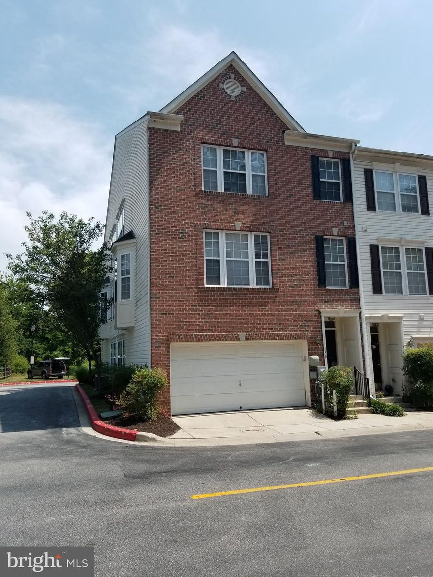 Take a look at this end unit, brick front 3 Level Townhome with a 2 car garage. Three bedrooms , 2 full bathrooms on upper 3rd level.  Beautiful hardwood flooring throughout the whole home. There is a  half bathroom on main level with a gigantic sun filled living room. Kitchen has a brand new Refrigerator, Stove and Dishwasher. Lower level provides extra living space. Condo fee includes roof, siding, common areas and outdoor community pool membership. Conveniently located between Baltimore /Washington commuter routes and close to BWI / Fort Meade. Howard county award winning schools here too. Hurry , this one won't last long.