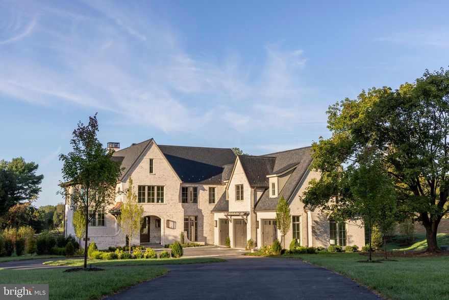 At the crest of Georgetown Pike, a new story begins. On more than two acres in the heart of Great Falls, a newly completed estate by Classic Cottages rises with quiet confidence. Spanning over 10,400 finished square feet with six bedrooms, six full baths, and three half baths, this home was designed to elevate every moment of modern living. 

The main level unfolds with an effortless rhythm, designed for both grand entertaining and the intimacy of daily life. At its heart, the kitchen commands attention: a sixty-inch Wolf gas range with dual infrared griddles, flanked by Sub-Zero refrigerator and freezer columns. A wine cooler, ice maker, dual dishwashers, warming drawer, and built-in coffee system complete the experience, while natural stone finishes ground it in timeless character. 

From here, spaces flow seamlessly—the Great Room anchored by a stately custom fireplace and the Dining Room bathed in light provide access to the Main Level Terrace with pastural views.  The spacious Family Room gives way to an exterior Family Room designed for all seasons, with automated Phantom screens, ceiling heaters, and its own gas fireplace. 

Upstairs, the Primary Suite offers its own private retreat.  A gas fireplace warms the space, while the spa-inspired bath invites indulgence: heated floors, a jetted tub, and dual steam showers with rain heads and sprays create a sense of serenity.  Secondary bedrooms are equally considered, blending privacy with thoughtful design, while a bonus room above the garage—with plumbing roughed in—offers the promise of future expansion. 

The lower level extends the home’s invitation to gather and enjoy. A full wet bar, complete with Fisher & Paykel refrigeration and Bosch dishwasher, sets the stage for evenings of entertainment. A wood-burning fireplace warms the entertainment room, while a temperature-controlled wine room with tasting area offers sophistication at every turn. A secure safe room and flex spaces, including a projection-ready room, ensure both peace of mind and boundless opportunity. 

Behind the beauty lies thoughtful infrastructure: Lutron lighting controls, integrated audio pre-wiring, and an elevator connecting all three levels. Dual Navien tankless water heaters, a four-zone HVAC system, and generator readiness ensure comfort and resilience. Outdoors, gas lanterns, irrigation-ready plumbing, and landscape lighting extend the refinement beyond the walls of the home. 

Whether it’s family dinners in the chef’s kitchen, quiet mornings in the primary suite, or lively evenings under the cedar pergola at the outdoor grill, this estate is designed to enrich each chapter of daily life.  

Ideally located east of Great Falls Village.  5 minutes to Great Falls National Park.  8 minutes to River Bend Country Club.  15 minutes to Tysons, 15 minutes to Reston, 20 minutes to Dulles Airport.  40 minutes to downtown Leesburg, 45 minutes to Washington, DC.