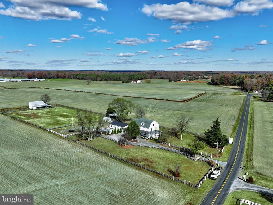 Stunning farmette recently renovated across three levels, nestled on a picturesque rural 4 +/-acre property. This modern farmhouse features 3 bedrooms, 3 bathrooms, and an expansive 3,731 square feet of living space.  The large primary suite begins with a spacious walk-in closet, custom en-suite bath and sitting area, and a balcony overlooking northwesterly views. Energy efficient improvements include conditioned crawlspace, spray foam insulation attic, and new windows and doors throughout. Enjoy the charm of a wrap-around porch, along with an inviting inground pool and paver patio accompanied by a spacious 1,500 sq ft pool house. Additionally, a 60 by 40 barn with a loft and over 2,100 feet of pasture fencing enhance the rural tranquility of the setting. Conveniently located minutes from downtown Easton. Interior photos coming soon.