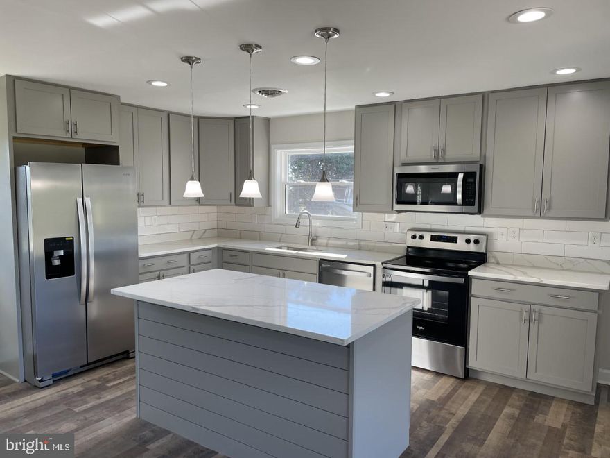 Renovated from Top to Bottom and Inside to Outside. 2021 renovation includes 5 total bedrooms and 3 total full bathrooms, new complete kitchen with SS appliances, quartz counters and island and new slow close cabinets, 3 completely renovated full bathrooms, new flooring throughout entire home and apartment, new windows, new roof,  new siding, 2 new HVAC systems, recessed lighting, security lighting,  paved driveway, professionally landscaped and much much more. This home also comes with a renovated in-law suite as well that consists of a living room, bedroom and full bathroom. The home sits on almost 3 acres that bosts peacefulness and privacy. Plenty of storage in the 2 attics but if that's not enough then the large detached garage and 2 storage sheds offers even more storage space.