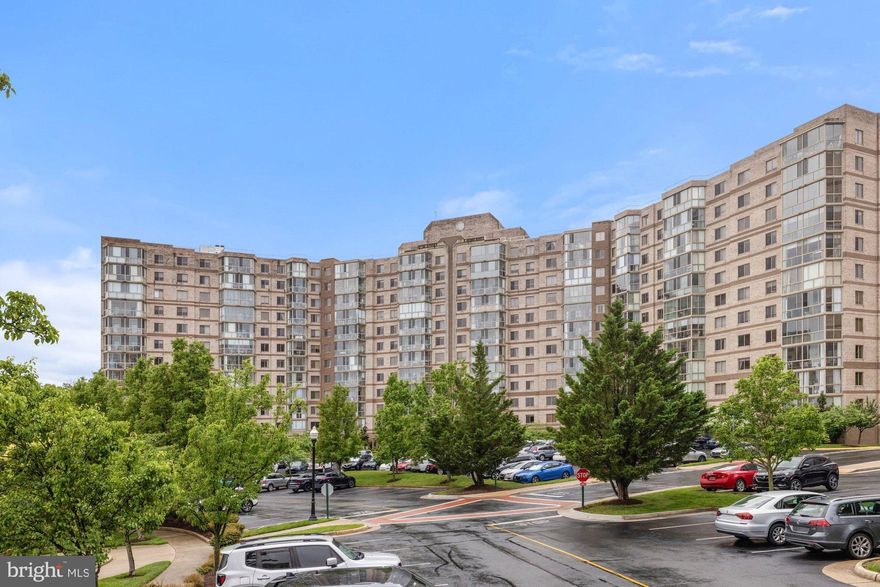 Welcome to this beautifully maintained 1,038 square foot 2 bedroom, 2 bath condo in the heart of the vibrant 55+ Lansdowne Woods community. Perched on the 4th floor, this unit offers serene treetop views and an abundance of natural light through floor-to-ceiling windows in the spacious glass-enclosed sunroom perfect for morning coffee or evening unwinding. Inside, you'll find fresh, neutral paint and brand new carpeting throughout the main living areas. The large living and dining area flows effortlessly into the sunroom and the adjacent kitchen, which boasts stainless steel appliances, ample cabinetry, and generous counter space ideal for both everyday meals and entertaining. The primary suite includes its own access to the sunroom, abundant closet space, and  private en-suite bath. A second bedroom and full bath are perfect for guests or  home office setup. HVAC and water heater systems are modern and efficient, giving peace of mind for years to come. Enjoy all the amenities Lansdowne Woods has to offer, including an indoor pool, fitness center, clubhouse, on-site restaurant, and shuttle service. Plus, you’re just minutes from shopping, medical centers, and major commuter routes. This condo offers comfort, convenience, and community all in one.