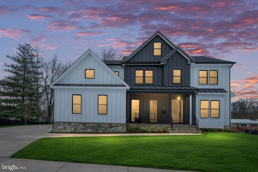 Nestled in the prestigious East Vienna Woods, this exquisite Transitional-style residence, built in 2023, embodies luxury and comfort. Located in the highly sought-after Vienna ES/Thoreau MS/Madison HS educational pyramid, and situated in the heart of Vienna, this property provides access to local parks, boutique shopping, fine dining, and a vibrant community known for its quality of life. The home offers outstanding access to the W&OD Trail for biking and running, as well as walkability to grocery stores, restaurants, the community center, farmers market, festivals, and parades, along with nearby daycare options. The property sits on a quiet street with very little traffic. Commuters will appreciate quick access to the Vienna/Fairfax-GMU Metro station on the Orange Line and convenient travel via I-66 to Tysons Corner and Washington, D.C.

Spanning over 0.38 acres, the property features a beautifully landscaped corner lot offering both privacy and an inviting front yard. The covered front porch includes an exterior outlet controlled by a switch in the foyer. The screened back porch includes one heater and is wired for a second. The backyard includes two gas lines for a grill, firepit, or whole-house generator, and the entire exterior is wired for cameras.

Step inside to discover a meticulously designed interior that blends warmth and sophistication. The open floor plan seamlessly connects the gourmet kitchen to the family room, creating an ideal space for entertaining. The kitchen features a commercial range with six burners and a griddle, recessed lighting, quartz countertops, soft-close cabinets and drawers, a butler’s pantry with beverage/wine refrigerator, a spacious island, and a built-in drawer microwave. Elegant crown moldings, recessed lighting, wide-plank LVP flooring, and floor-to-ceiling black Marvin windows create a cohesive and welcoming interior.

With six generously sized bedrooms, each featuring a private bathroom and walk-in closet with built-in closet organizers, and six and a half bathrooms, the home is designed for both comfort and functionality. The primary bathroom includes heated tile flooring, a spa-style soaking tub, dual walk-in closets, and a bonus room.

The fully finished basement includes walkout stairs, ample windows, an exercise room, a media room, and a wet bar or kitchen rough-in, providing flexible living and recreation space. On the second upper level, a full-size door leads to a fully conditioned attic that can easily be finished into a seventh bedroom, craft room, music room, or other living space, with room for a full bathroom.

Outside, the side-entry garage accommodates two vehicles and includes two EV charging outlets, complemented by a concrete driveway with parking for four additional vehicles. Flood lights and a robust gutter system add practical exterior functionality. This residence offers a compelling combination of modern construction, thoughtful design, and convenient access to the Town of Vienna’s amenities.