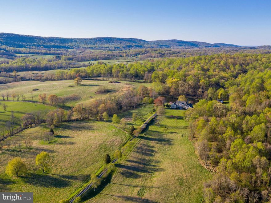 Property in Land Use Hay & Forestry.  NOT in Conservation easement.   Zoned AR1.  Property lends itself to endless possibilities ..Open & rolling fields plus Wooded Mountain area. VIEWS in every direction.  Stocked POND with Bass, Blue Gills, Catfish & Carp.  Per Seller:  Soil has been tested by VA Tech and is suitable for grapes.   Excellent Equestrian  potential.  Close to the AT & Parkland. Tennis Court. 2 detached Garages give an additional 5 bays of parking.. Well-appointed home features over 12,000 sf of finished space. Main level Master suite.   Nanny  suite/apartment. Many separate/private living areas. 8 Fireplaces!  Sauna. Patios. Auto Generac  generator.   All  NEW Windows Dec 2020