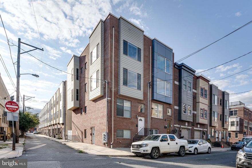 Welcome to 1024 S 19th St Unit B, a spacious and modern bi-level condominium located in the highly sought-after Graduate Hospital neighborhood. Built just 10 years ago, this beautifully maintained 3-bedroom, 3-bath home boasts over 1,800 square feet of contemporary living space and features an open floor plan designed for comfort and entertaining. Step into a sun-soaked living and dining area with gleaming hardwood floors, recessed lighting, and oversized windows that flood the space with natural light. The gourmet kitchen is equipped with stainless steel appliances, granite countertops, a large breakfast bar, and ample cabinetry. The main level features a private bedroom and full bathroom, ideal for guests, a home office, or flex space to suit your needs. Upstairs, two spacious bedrooms each boast their own en-suite baths, offering maximum privacy and comfort for any living arrangement. A dedicated laundry room is conveniently located on the upper level, making everyday chores a breeze. One of the standout features of this home is the private roof deck, enjoy unobstructed skyline views of Center City, perfect for entertaining or relaxing above the bustle of the city.  Enjoy the best of city living with unbeatable access to everyday essentials and neighborhood favorites. Just blocks from Sprouts, Target, ALDI, Giant, PetSmart, Wine & Spirits, and Starbucks, your grocery runs and errands are a breeze. Grab a bite or drink at local staples like Chick’s, Sidecar Grille, or American Sardine Bar, and unwind at nearby Chew Playground. Commuters will appreciate the quick access to CHOP, Penn, Drexel, the South Street Bridge, and I-76. You’re also just minutes from Rittenhouse Square and surrounded by a wide array of dining, shopping, and public transit options that make getting around and enjoying the neighborhood effortless. The property is in process of being subdivided from a duplex to two condos and will be completed prior to settlement.