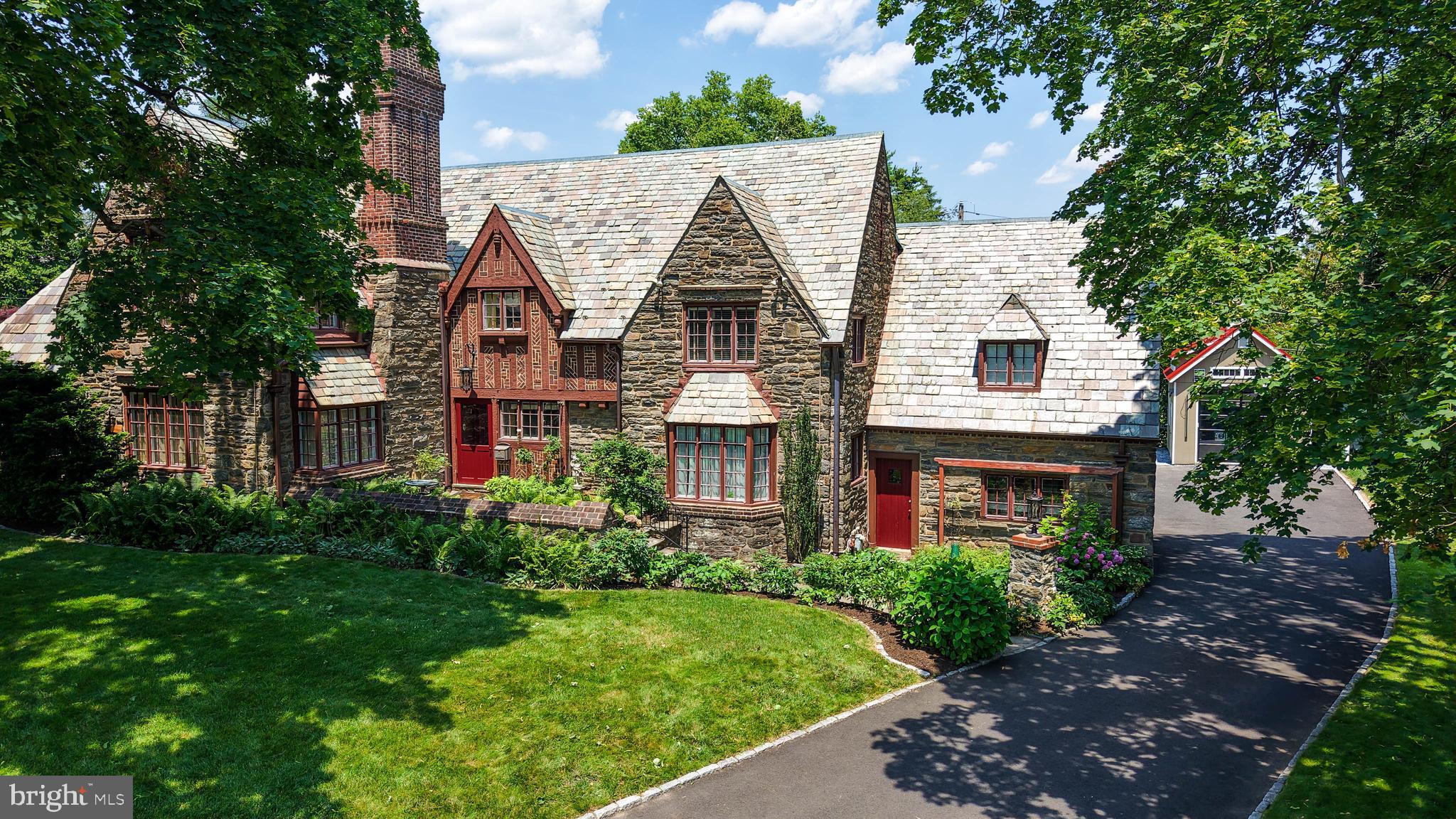 This absolutely incredible, 5-bedroom, 3.5-bathroom 1920s renovated historic home in the highly sought after Jenkintown Manor, Abington School District, will surely take your breath away. After completing over $500k in upgrades, relocation is the only reason these sellers are leaving this stunning, move-in ready property! An absolute entertainer's delight, this property boasts a top-of-the-line, built-in, outdoor kitchen with Lynx and True brand appliances and granite countertops alongside a gorgeous in-ground pool and patio with charming trellis and twinkling lights. This incredible outdoor oasis also provides a relaxing firepit area, garden beds, stone retaining wall, and privacy fencing. A custom detached garage, long asphalt driveway with turnaround, and two-car attached garage provide plenty of parking for you and your guests. The 53 handle, fully renovated indoor kitchen is equipped with custom cabinetry and custom Mercer tile, top-of-the-line appliances, 50-year hardwood floors, and custom Tiffany lighting with a stunning picture window view of the amazing backyard. The incredible home theatre is complete with a 4K projector and Dolby Atmos surround sound with quality even better than going to the movies. As you walk through the home, you will notice that it has been painted with a time period appropriate pallet and offers time period matched lighting for added charm. The vast living room offers a cozy wood burning fireplace and a secret, stowed away dry bar with lighting and a locked storage cabinet, built-in book shelving, and a fantastic reading nook in the deep windowsill over the wood storage. A sunroom with a Dutch door to the stunning outdoor patio is one of the many highlights in this gorgeous home. The primary suite offers vaulted ceilings, a walk-in closet with built-ins, and its very own private bath boasting Italian Marble and a walk-in shower with glass door enclosure and new fixtures. The guest bath offers a $30k renovation with absolutely stunning emerald tile, custom mosaic mirror, heated towel bar, and more. The home is additionally equipped with a new generator, high-velocity HVAC system, all new electrical, brand-new boiler, hardwired alarm system, and much, much more. You absolutely must schedule a private showing to see all this one-of-a kind home has to offer, before it is simply too late!