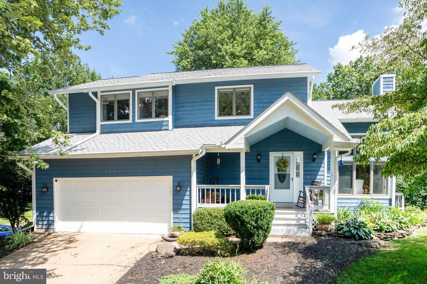 Welcome to this beautiful colonial, offering the perfect blend of modern day elegance and comfort.   Upon entering you will notice the home's pristine condition and welcoming atmosphere making it a top pick . Nestled on a beautifully maintained lot in a popular community, this home is ready to be called  your own. Warm wood flooring flows throughout the main and upper levels.    The open floor plan  creates the perfect flow ideal for entertaining.  The living room features a vaulted ceiling and a dramatic two-story stone fireplace, filled with natural light.  The  heart of the home is a gourmet kitchen, designed with stainless steel appliances,  with a spacious layout featuring plenty of counter space and abundant storage making it perfect for cooking and gathering.   Adjacent to the kitchen is the dining area, offering a welcome space overlooking the yard.  Off the kitchen is the family room  creating more space to enjoy the family and entertain.   The family room leads to a huge all weather screened in porch with a mini split that overlooks the manicured yard   featuring  mature landscaping. Upstairs  are 3 generously sized bedrooms designed for comfort.  The primary bedroom suite is a retreat featuring a deluxe ensuite bathroom with a vintage-style claw foot soaking tub/shower  and a huge walk-in closet,  The lower level offers  more finished space with 2 bonus rooms, a full bathroom,  and a large laundry room with plenty of storage.   Plenty of parking with a large two car garage and drive way offering  plenty of off street parking.  This home  offers a perfect blend of  privacy  within walking distance to restaurants  and local shops.  It's turn key ready !   Don't miss the opportunity to make this your home!!