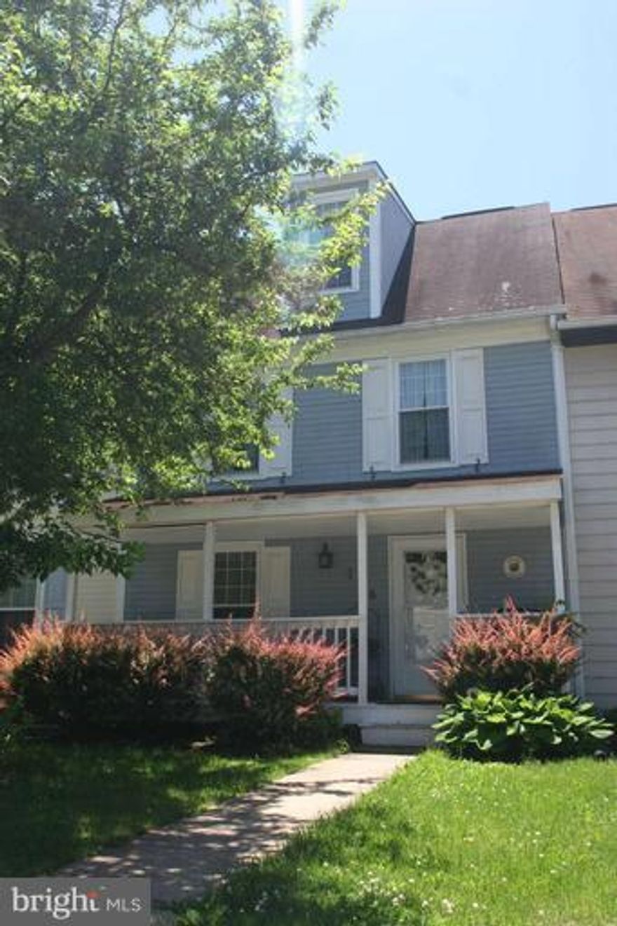 Must see spacious townhouse! Its larger than it looks this model has 4th floor master bedroom. Home is in move incondition with three spacious bedrooms and two and half baths. Finished walk out basement, large deck, cute back yard backing to woods.Updated floors on all levels, fresh paint, updated baths and front porch.