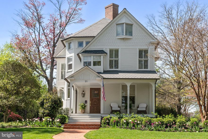 Sited on a prominent double lot in the heart of Annapolis' Murray Hill neighborhood, 21 Southgate Avenue is a masterfully reimagined home. Originally built by the Southgate family in the late 1800s, this one-of-a-kind estate blends formal sophistication with effortless Annapolis charm. Honoring its architectural heritage while delivering the luxuries of today, the home was crafted by Reverend Southgate and enjoys sweeping views of the steeples and spires of the city's treasured landmarks. A Full Restoration and Renovation was recently completed in 2024/2025.

A newly expanded brick sidewalk entry welcomes you to the home, setting the tone for the thoughtfully curated elegance found within. Perched on a double elevated lot, the home features a generous front porch—an ideal spot to enjoy your morning coffee while taking in the ever-changing landscaping and vibrant neighborhood life.  Step through the grand entry, where light from oversized windows bathes the foyer, and find yourself in a home where craftsmanship reigns. Brand-new white oak floors, installed to match the classic look of the 1800s, elevate the home’s aesthetics, while wainscoting, soaring ceilings, high-end lighting fixtures, and antique fireplaces create warmth and soul in every room. Modern conveniences blend seamlessly with period details, including a large mudroom complete with a full bar, ample storage, and a beautifully re-designed half bath.

The kitchen is a dream — flooded with natural light from oversized windows and accented with a charming banquette. It opens seamlessly to the outdoors, inviting the fully fenced rear yard and garden inside, turning every meal into a memorable moment. The living and dining rooms set the tone for both casual and refined entertaining, with beautiful proportions and timeless finishes throughout.

Upstairs, the primary bedroom offers a peaceful retreat — generously sized, filled with natural light, and anchored by a spacious walk-in closet with custom built-ins. The sleek and sophisticated ensuite bathroom features a double vanity, Waterworks tile, a deep soaking tub, and a frameless glass shower with a ceiling-mounted rainfall fixture, designed for both style and function. Two additional bedrooms on the second level share a large classically timeless hall bath. The finished third floor offers a full suite, including a newly renovated bathroom with Waterworks tile and marble floors, as well as a private porch area overlooking the backyard and stretching over the treetops to downtown Annapolis.

Outside, the magic continues. The professionally designed garden and oversized yard offer a rare sense of space in the heart of historic Annapolis. Whether hosting lively family gatherings, lacrosse practice, or tossing the ball, the front and rear yards are designed to accommodate it all with ease. Curated landscaping with a new 16-zone irrigation system and custom lighting weaves color, texture, and serenity throughout the property, while the new bluestone patio and outdoor kitchen create the perfect backdrop for everything from festive celebrations to the most intimate garden dinners under the stars.
At 21 Southgate Avenue, history, craftsmanship, and modern luxury come together to offer a timeless Annapolis lifestyle — where every day feels like a celebration of home.