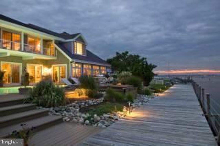 Spectacular Bayfront Home is ideally sited to enjoy the breathtaking day and night views of the Ocean City skyline from all major rooms. Flexible open concept plan for carefree summer living with loads of room for family and guests. Entertain in the Chef's kitchen, Sun by the Bayfront pool, Fish the Thoroughfare from the Bayfront boardwalk, Adjacent boat basin has room for 2 boats, jet skis and kayaks. 1st and 2nd level Master Suites. 3 Gas Fireplaces. One of a Kind Waterfront Location and Outdoor Features cannot be duplicated!! Must see Home!!!