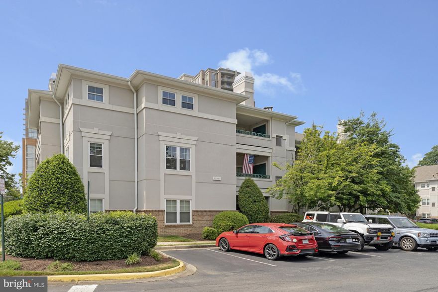 Welcome to this thoughtfully updated 2-bed, 1.5-bath ground-level condo offering just over 900 sq ft of stylish living in the heart of Reston. Enjoy fresh paint (2024), new LVP flooring (2024), and a completely renovated kitchen with quartz counters, white shaker cabinets, stainless steel appliances, and bar seating that opens to a dedicated dining area(2024). The spacious living room features a cozy gas fireplace and direct access to a private, oversized deck—perfect for relaxing or entertaining. The primary suite includes a walk-in closet and fully renovated en-suite bath(2024), while the second bedroom offers flexibility for guests or a home office. A renovated half bath (2024), new washer/dryer (2024), new fridge and thermostat (2025), a garbage disposal with lifetime warranty, and a storage unit just across the hall add convenience. Enjoy community pool and gym access, permit parking, and a location just a short walk to Reston Town Center, Metro, parks, shops, and dining.