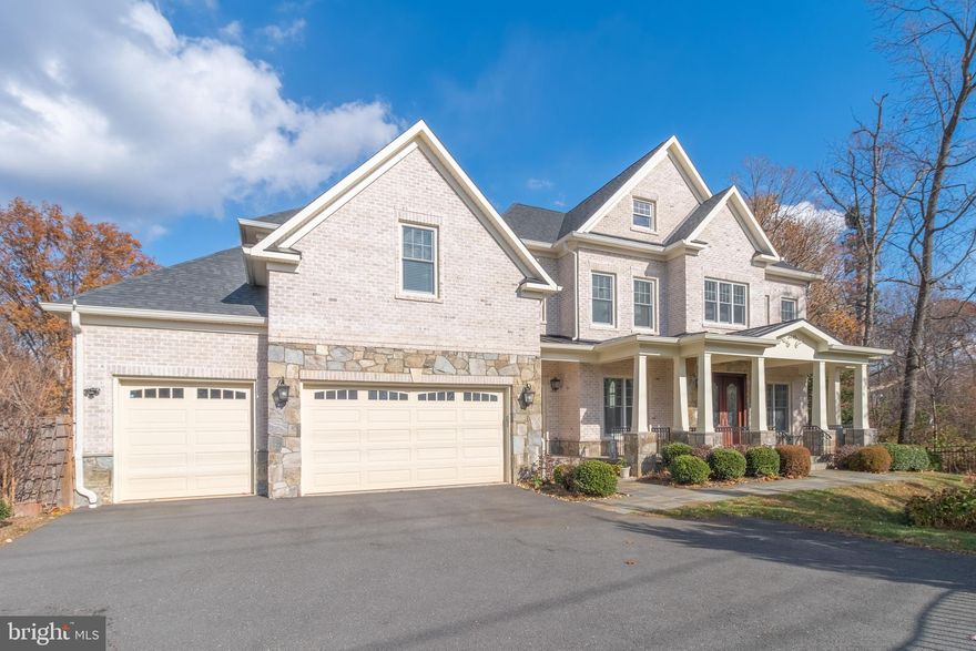 Elegance and opulence converge in this magnificent residence within Woodburn Estate, offering a seamless blend of modern comfort and grandiose luxury. Boasting Seven bedrooms and eight bathrooms, this custom-built home features a distinguished solid oak staircase and tray ceilings. The architectural design is timelessly classic, with a full brick and stone exterior exuding sophistication.

The gourmet kitchen is a culinary haven. The eat-in kitchen is a chef's delight, featuring custom cabinetry, a butler's pantry, and  equipped with high-End stainless steel appliances, granite countertops, and a custom-built oversized island with seating. With 10-foot ceilings and crown molding throughout, this residence spans approximately 7500 square feet of living space on a half-acre lot.

Every detail has been meticulously considered, from the stunning architectural features to the brick and stone facade. The main level welcomes you with 10-foot ceilings, a two-story foyer adorned with marble flooring, and a circular solid oak staircase. 

Convenience is key, with a main-floor in-law suite complete with a full bath and walk-in closet. The foyer and hall lead to the dining, living, and family rooms, along with a separate office ideal for remote work. Access the spacious deck from three separate entrances on the main level, offering a retreat to the tree-lined backyard and expansive open space.

The lower and upper levels feature 9-foot ceilings, complemented by extensive hardwood flooring. Gas fireplaces in the family room, primary bedroom, and recreation room add warmth and ambiance. The living room, dining room, and powder room showcase exquisite 2-piece crown molding, while the foyer and upper hall boast a 3-piece crown molding. The dining room further features chair railing and shadow boxes.

High-end lighting fixtures illuminate the entire space, creating an inviting atmosphere. The primary suite is a sanctuary, featuring spacious walk-in closets, a Jacuzzi soaking tub, dual Moen shower heads, and cultured marble sinks. Four additional bedrooms on the upper level share two full bathrooms and a Jack and Jill bathroom. The convenience of an upstairs laundry room with a sink adds to the overall functionality.

The walk-out lower level, accessible through two separate entrances, offers a seventh bedroom with a full bath, a recreation room with a wet bar and granite countertops, a theater room, and a large storage room. This luxurious custom home in Woodburn Estates leaves no stone unturned in delivering a lifestyle of unparalleled comfort and sophistication.