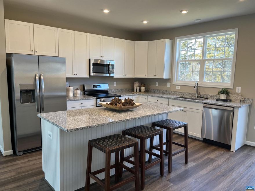 Immediate Move-In! This stunning 3-level townhome offers over 1,850 sq. ft. of beautifully finished living space, complete with a 1-car garage. Featuring 4 bedrooms and 3.5 baths, this home is designed for comfort and style.  The rear kitchen layout boasts a 6-foot island, 42" cabinets, a step-in pantry, quartz countertops, and stainless steel appliances. The owner?s suite includes dual vanities, a step-in shower, and a spacious walk-in closet. All baths and the laundry room feature ceramic tile floors and shower surrounds.  Additional highlights include LVP flooring in the foyer, kitchen, family, and dining rooms, plus a security system for peace of mind. HOA covers lawn care for easy living.  Photos and virtual tour may contain options that are not standard on all models or not an included feature. Pictures and virtual tour are of a model home and show optional upgrades.  Ask about current incentives when using our preferred lender and title company!,Maple Cabinets,Quartz Counter