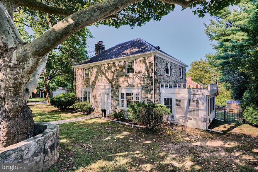 Stunning Classic Center Hall Stone Colonial on a corner lot in the much sought-after Chatham neighborhood close to countless commuter routes. The expansive living room boasts gleaming hardwood floors and crown molding. The lovely dining room has a chair rail and a gorgeous chandelier. The dazzling eat-in kitchen has granite counters, stainless appliances, a planning station, a breakfast bar, ample soft-close cabinets, and stylish pendant lighting. The wonderful sunroom with exposed stone walls and floors, sunny windows, and recessed lighting is the perfect room for entertaining. Besides the grand entrance foyer, the side entranceway is impressive with its stone surround and cathedral ceilings. The sizable primary bedroom has two sunny exposures, a ceiling fan, and a spa-like, en-suite bath. There are two additional generously sized bedrooms. The newly finished lower level has been transformed into a large relaxing family room with built-ins, laundry/storage room, and full bath.  Enjoy the newly fenced private backyard with plenty of room to play and entertain. 2-car garage and parking off Tamworth Rd. This home falls in the Roland Park school district. Key home features include a hot water heater, washer, dryer, and all kitchen appliances that are approximately three years old. Additionally, new gutters were installed in 2024.