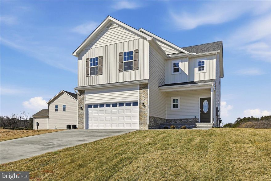 The home is vacant, move-in ready, with preselected upgrades and a one-year home warranty. Welcome to
this beautifully crafted new home by a respected local builder, offering almost 2,000 square feet of
thoughtfully designed living space in the desirable Sovereign Village community with room to grow in the
unfinished basement. The inviting, open-concept main level features a spacious kitchen with a large island,
perfect for gathering and entertaining, that seamlessly connects to the dining and living areas. The family
room features a beautiful fireplace and opens to the large patio and yard, backing to green space. Upstairs,
you’ll find three bedrooms with generous closets, a shared hall bath, and the home's large primary suite with a massive walk-in closet and a beautiful ensuite bathroom with a tiled walk-in shower. Every detail of
this home reflects quality craftsmanship and modern style, with numerous upgrades and dual-zone HVAC
for year-round comfort. Sovereign Village is a sought-after community with sidewalks, open green spaces,
and an optional membership pool for summer fun. Conveniently located just off Route 7 and less than four miles from Old Town Winchester, this home offers the perfect blend of modern comfort, community living,
and commuter convenience. Don’t miss your chance to make this stunning new home yours! Other homes available, 102 Brockham Ct, 100 Brockham Ct,  619 Farmington Dr., and 253 Rossmann Blvd.