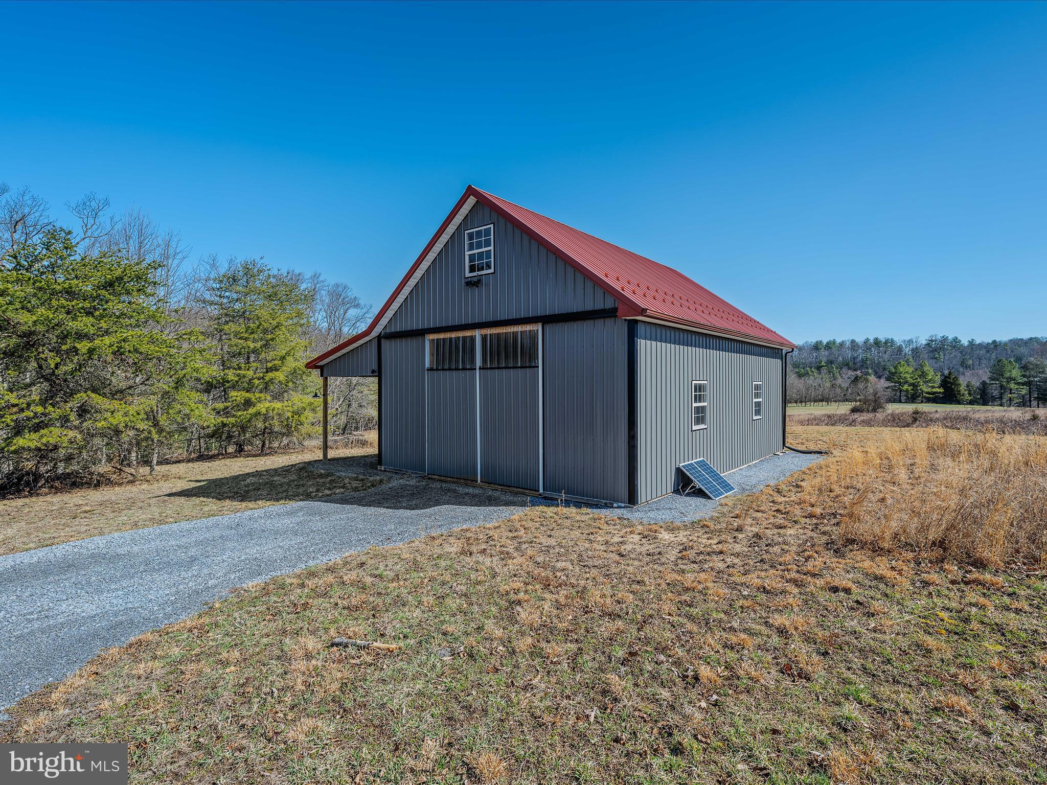 3 lots totaling 7.41 acres of beautiful open land that reaches down to the Sleepy Creek and in some places across the creek. The barndominium style shell is completed on the exterior. Sellers have enjoyed the property as their weekend getaway off the grid. They have watched the eagles soar, enjoyed fishing, stargazing, and quiet nights around the campfire. Original Septic permits available. Enjoy as they have or have your builder come in and complete the project for full time living. Hike to creek from the property or walk to the common area and follow the path to the Sleepy Creek.
