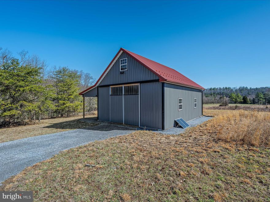 3 lots totaling 7.41 acres of beautiful open land that reaches down to the Sleepy Creek and in some places across the creek.  The barndominium style shell is completed on the exterior.  Sellers have enjoyed the property as their weekend getaway off the grid.  They have watched the eagles soar, enjoyed  fishing, stargazing, and quiet nights around the campfire.  Original Septic permits available.  Enjoy as they have or have your builder come in and complete the project for full time living.  Hike to creek from the property or walk to the common area and follow the path to the Sleepy Creek.