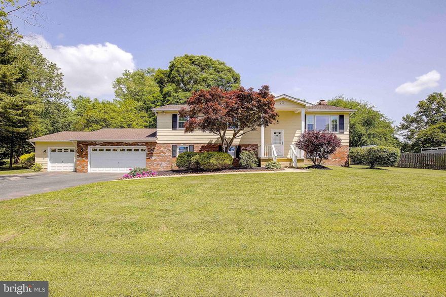 Ready to start your eastern shore life in a quiet water access community? 205 Drovers Way in Tower Gardens is waiting for you to say, "YES TO THE ADDRESS!" The upper level features three bedrooms and 2 full baths (one bed/bath is the primary suite), sunny living room with views out to the Bay, separate dining and generously sized kitchen. Large entertaining sized deck is steps off the dining room and overlooks the 1 acre lot. Looking for a home office and multiple living spaces? We've got you covered! The lower level family room features a cozy woods stove plus there is a 4th bedroom, 3rd full bath and even a home office or fitness center. BONUS! Three car garage has inside access and is perfect for all your toys or a workshop. Tower Gardens community members enjoy their own private beach along the Chesapeake Bay, boat ramp, ball fields and tot lot for an annual HOA fee of $75! Move in ready for you to put your own touches on it!