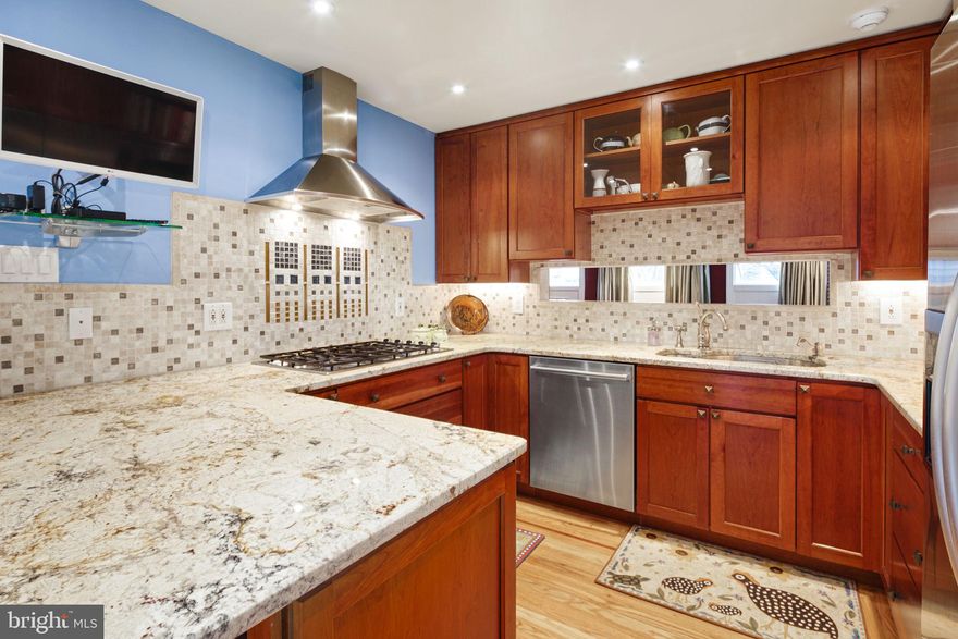 Beautiful Society Hill home with deeded parking and TWO private outdoor spaces where pride of ownership is truly evident! This home boasts four bedrooms, 2.5 bathrooms and hardwood flooring throughout. The southern exposure drenches the entire floor plan in natural light through floor to ceiling windows throughout the house. The kitchen and bathrooms have been recently remodeled and are absolutely stunning. The chef's kitchen has a gorgeous tile backsplash, granite countertops, and breakfast bar, as well as built-in cabinetry that flows into the dining area. Cherry wood cabinets and drawers are extra deep, giving you tons of added storage. High-end appliances include a 5-burner DCS gas cooktop, Bosch dishwasher, KitchenAid refrigerator, Whirlpool Gold Series oven, Sharp convection/microwave, and Franke double sink. Heading to the living room, you'll find double height ceilings with a beautiful fireplace and mantle, plus access to the large private brick patio waiting for you to garden, entertain and relax. The top floors have beautifully renovated bathrooms with designer fixtures, and tiled, glass-enclosed showers. The bedrooms are all large with great closet space. The primary bedroom has his and hers custom closets and a built-in dresser. The second-floor bedroom has built-in custom cabinetry. Off the top bedroom level, you'll find the second private outdoor space, perfect for sunbathing, gardening, or just enjoying the outdoors! There is also a beautiful room on the first floor of the home with a bathroom - ideal for home office, au pair suite, gym, or guest bedroom. There is a laundry room with additional storage closets. Walk to Jefferson Hospital, Pennsylvania Hospital, Washington Square Park, Three Bears Park, Historic Independence Mall, the waterfront, and dozens of excellent restaurants to enjoy. Live in this iconic Historic Philadelphia neighborhood with all of the amenities one can ask for in a home! (It is the responsibility of the buyer to verify taxes and square footage.)  Access the Parking- go out of the door at the rear of the back yard, there is a walkway to the parking spaces, towards 6th street at the end of the walk way.