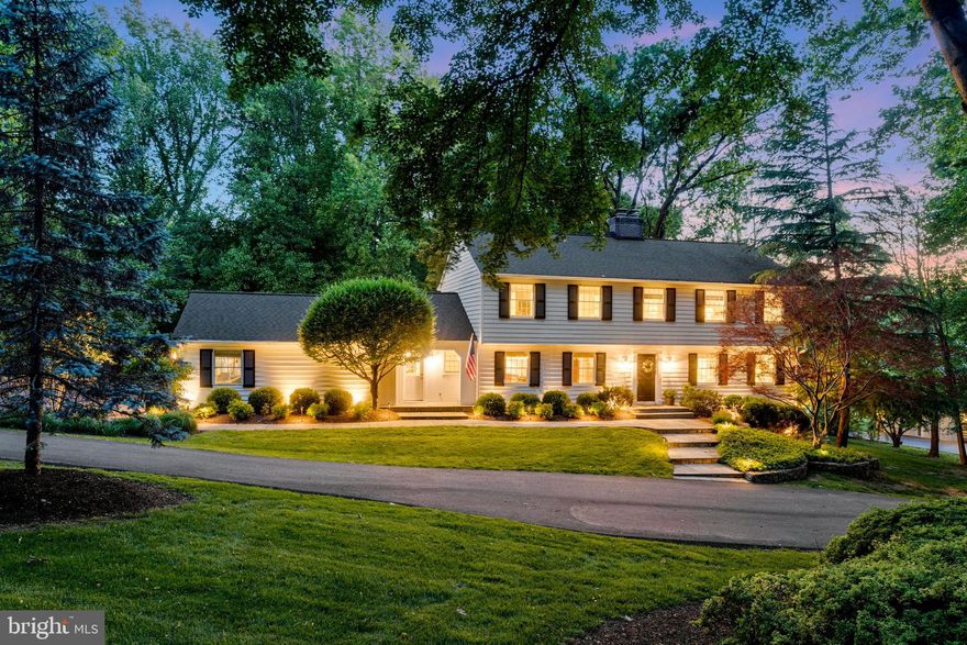 Welcome to this stunning clapboard Colonial sited on almost 2 acres of private, serene landscape. A picturesque circular driveway leads to the front entrance, where a foyer with detailed crown molding and wide baseboards sets an elegant tone. A side-positioned central staircase adds to the home’s charm. The interior has been extensively remodeled including kitchen, baths, windows, and award-winning basement redesign.  

The spacious living room boasts exquisite chair rail, shadow boxing, as well as rich 4-piece crown molding and custom window treatments. The formal dining room features a hand-painted coffered ceiling and is ideal for elegant entertaining.

Beautiful hardwood flooring throughout the main and upper levels adds warmth and continuity. The chef’s kitchen features a large butcher block island, a five-burner Thermador induction cooktop with a Zephyr high-capacity exhaust hood, two full-size Bosch stainless steel ovens and built-in KitchenAid microwave.  Carrara marble countertops complement a spacious Shaw farmhouse sink, with natural light streaming through oversized casement windows. Top-tier appliances include a smart Thermador column refrigerator, cabinet-front Thermador freezer, and a Miele dishwasher. There is also a built-in breakfast bar for casual dining as well as a large appliance cabinet, built-in shelving and cabinetry. 

Off the kitchen is a custom-built walk-in pantry and laundry/mud room featuring Miele washer and dryer, a marble countertop for folding laundry, and a full sized-sink.

Adjacent to the kitchen, the family room includes custom built-ins and a natural wood-burning fireplace with a pillowed stone surround and a private office/library retreat with plantation shutters and custom shelving . The stunning three-season octagon room features a cathedral, wood-beamed ceiling with plantation-style ceiling fan, new windows, and three sliders opening to the Trex deck. 

Upstairs, the roomy primary suite offers a Juliet balcony with views onto the pool and backyard, large custom walk-in closet, ceiling fan, recessed lighting, and custom cabinetry. The luxurious ensuite bath features heated floors in white Calacatta marble, open rainhead shower, heated towel rack, soaking tub, dual vanities, and a private water closet.

Three additional bedrooms with hardwood flooring, ceiling fans, and ample closet space. The updated hall bath has Carrara marble vanity, subway tile, and a Kohler soaking tub.

 The fully finished lower level has luxury vinyl plank flooring, a bath with a walk-in shower that connects to a workout room that could function as an additional bedroom space. A recreation room with a wood burning fireplace; coffered ceilings; flagstone patio walkout, gaming nook, a dedicated wine-tasting room/library with custom shelving and a wine cellar with built-in refrigerator and 200 bottle capacity.

The large storage/utility room houses updated mechanical systems: two heat pumps, well equipment, water softener, electric hot water heater, and a Honeywell propane backup generator switch connected to a buried 250-gallon propane tank. The generator powers approximately 80% of the house. Electrical systems were updated in 2022. 

The outdoor space is an entertainer’s dream with access from the three season room and kitchen to the outdoor deck and beautiful saltwater pool with electric heating, flagstone patio, professional landscaping and lighting, mature trees, a spacious backyard, and a private side yard patio.

 The community includes 14.5 acres of private land with tennis courts and pond access for fishing and recreation. Hike to the Potomac and Great Falls National Park via the Cross-County Trail. Convenient access to the Metro, Dulles Airport, and major routes. Nearby destinations include Tysons Corner and Reston Town Center, offering world-class shopping, dining, and entertainment.