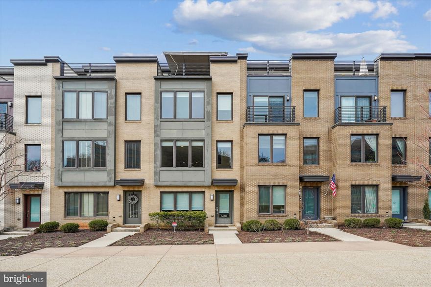 Discover the best-kept secret in Bethesda—Montgomery Row, an exquisite EYA contemporary community built in 2016. Ideally situated for commuters, shoppers, and culinary enthusiasts alike, this stunning home offers the perfect balance of luxury and convenience. This sundrenched outer row home offers an unmatched peaceful, open, and airy water view unobstructed by other townhomes for a tranquil oasis within an urban setting. Each of the 3 bedrooms includes its own en-suite bathroom to ensure privacy and comfort for everyone. The thoughtful design blends modern elegance and a coveted 2-car garage. One of the standout features for this home is the upper-level loft and top floor patio that affords access to take in the best nature view of any other townhome in the neighborhood: a pond framed by ever-changing foliage, including cherry blossoms in springtime.  This is truly a 3-season retreat, equipped with a retractable sun awning for shade on summer days, an outdoor gas fireplace to keep you cozy on fall nights while sipping your coffee or wine, and a custom upgraded gas line for year-round grilling. This outdoor space is perfect for both relaxing and entertaining. With over $51K in upgrades, this home exemplifies attention to detail. Highlights include high-quality blinds, a central vacuum system, oak stairs, an upgraded appliance package, quartz countertops, upgraded tile and a frameless glass shower door. The owner's bedroom and bathroom boast high ceilings, a walk-in closet, and a beautiful owner's bathroom complete with a double vanity and stunning luxury shower. The main living level is light and bright to evoke Malibu beach house vibes. The open concept design allows ample kitchen work space that flows into a dining area and lounging and entertainment space. Montgomery Row is a vibrant community offering a wonderful play area, electric car chargers, and professional grounds maintenance and multiple parking options. You’re minutes from I-270, I-495, Old Georgetown Road, and Rockville Pike, not to mention an array of dining, shopping, and entertainment options, including Baldacci’s, Starbucks, Montgomery Mall, Pike and Rose, and more.