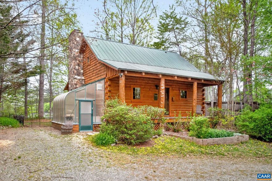 Welcome to your private waterfront escape directly on Green Acres Lake, offering year-round mountain views and a private dock ideal for boating, fishing, swimming, and kayaking. This classic two-story log cabin has been meticulously maintained with recently refinished exterior logs. Take in dramatic sunsets from the covered rear porch, gather around the fire pit, or enjoy gardening in the greenhouse. Inside, the main level presents a family room anchored by a stone fireplace and Jotul wood-burning stove. The updated kitchen features granite countertops, custom copper accents, and newer GE black slate appliances. A flexible main floor bedroom and full bathroom provide an ideal dedicated workspace or guest setup. Upstairs, the lofted primary suite showcases sweeping lake views and a remodeled ensuite bathroom. Recent improvements include a new high-efficiency Trane HVAC, water heater, pressure tank, and fully encapsulated crawlspace. Offered mostly furnished, this turnkey retreat is just 15 minutes from Shenandoah National Park and close to local vineyards and breweries. Minimum rental term of 30 days per HOA rules.,Granite Counter,Fireplace in Family Room