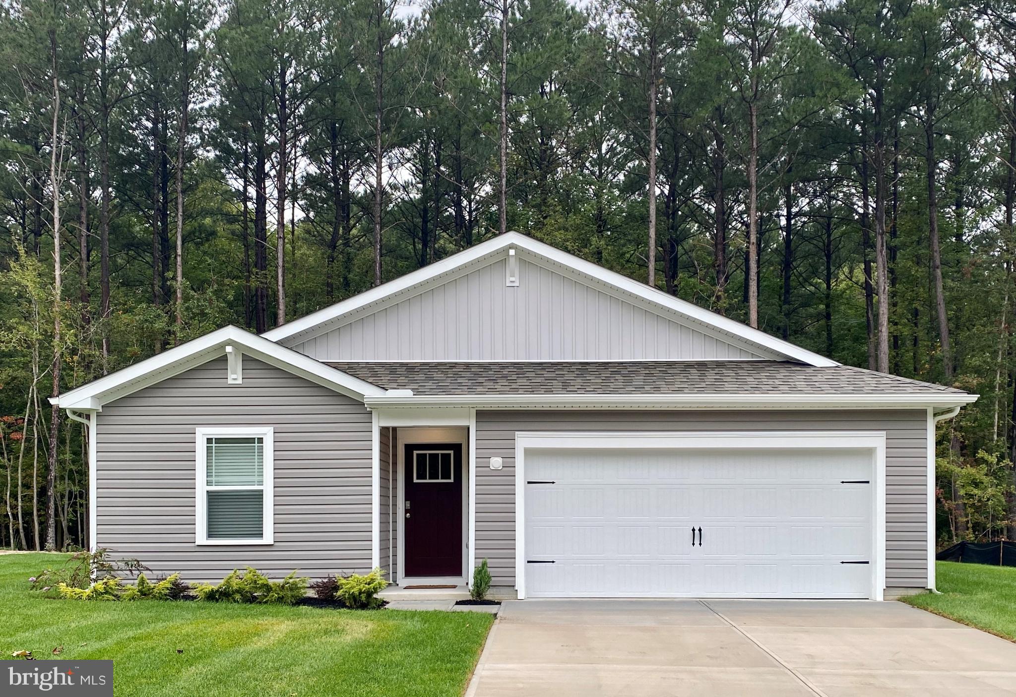 Discover 1115 Darrow Court, a new construction home in the Birdsong Village community of Salisbury, MD. Located on a cul-de-sac, the Boardwalk is a 1,385 square foot ranch home that offers three sizeable bedrooms, two full bathrooms and a two-car garage.
A long, welcoming foyer allows for the two guest bedrooms and guest bathroom to be separate from the main living areas. The functional kitchen has stainless steel appliances, classic white cabinets, a spacious pantry closet, and a peninsula island with quartz countertops and room for additional seating. Enjoy the open concept as it allows you to entertain guests in your great room and kitchen simultaneously.
The owner's suite is set apart at the back of the home and features a walk-in closet and full bathroom with a tiled walk-in shower. The laundry room is tucked away near the entrance to the two-car garage.
This home includes white window blinds, a fully sodded, landscaped, and irrigated lawn, and the exclusive Smart Home® package through ADT, giving you complete peace of mind in your new home.
Pictures, artist renderings, photographs, colors, features, and sizes are for illustration purposes only and will vary from the homes as built. Image representative of plan only and may vary as built. Images are of model home and include custom design features that may not be available in other homes. Furnishings and decorative items not included with home purchase.