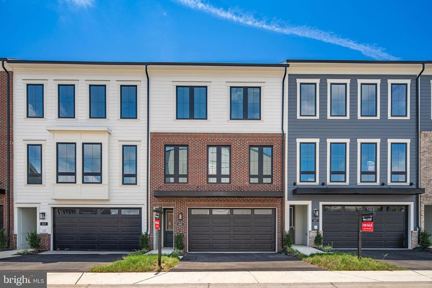 NEW MILLER AND SMITH HOME IN BEACON PARK AT BELMONT BAY. MOVE IN READY! The areas premier 55+ active adult community! This stunning personal elevator Galleon plan features almost 2800 square feet of finished living space on 3 levels. Front entry 2 car garage, James Hardie siding, a screened porch with Trex deck, rear patio, and lower-level 4th bedroom with full bath. Elegant hardwood staircases and EVP maintenance free flooring in many areas. The primary suite comes prepared with a zero-entry shower for ease of daily life, tray ceiling in primary bedroom and ample walk-in closet. A main level chef's kitchen is a dream come true with soft close shaker cabinets, quartz countertops, stainless appliances including French door refrigerator and a generous walk-in pantry. Also, on the main level- a dining room, thought nook, and spacious room family with a floating modern electric fireplace. Price includes all the sought after luxury finishes!! Homesite is within walking distance to Belmont Bay Harbor Marina, walking trails, parkland preserve, shops, and more! VRE within the Belmont Bay community! *$15,000 in option credits have already been applied. Price/terms/availability subject to change. SALES OFFICE OPEN DAILY FROM 11AM - 5PM.