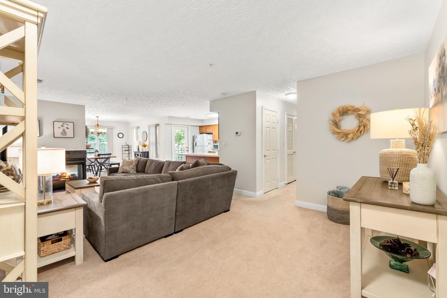 Welcome Home to one of Maryland's most desirable locations and the Admiral's Reach at Harbour Gates Community.  Experience upscale living in this beautiful, spacious and move-in ready Condo nestled in the highly desirable Admiral's Reach Community of Annapolis.  Featuring an abundance of natural  sunlight throughout and gorgeous open floor plan with style and serenity.  Bright eat-in Kitchen with a beautiful French (style) door that opens to your own private balcony with peaceful views.  Relax in the stylish, open living room and beautiful dining area with a lovely 2-sided Fireplace to enjoy all year.  
There is an abundance of windows and tons of natural sunlight throughout.  Huge Primary bedroom with large walk-in closet and ensuite bath.  Generously sized 2nd Bedroom.  Hall Bathroom for convenience.  Lovely well-maintained Unit. Freshly painted and new Carpet.  Large Utility room with full-size Washer & Dryer.  The Balcony overlooks manicured green space and beautiful trees.  Community Amenities include the Outdoor Swimming Pool, Clubhouse Community Center with Fitness Center.  Enjoy Tennis Courts, Basketball Courts and Picnic area with Grill also available.  Condo/HOA Fee:  $393.13. Unbeatable location.  Convenient to Shops, Premier Restaurants, Historic Annapolis, Eastport, U.S. Naval Academy, I-97, Rt 50 & so much more!! Perfect blend of luxury and convenience.  Schedule a private tour today and make this home YOUR home!