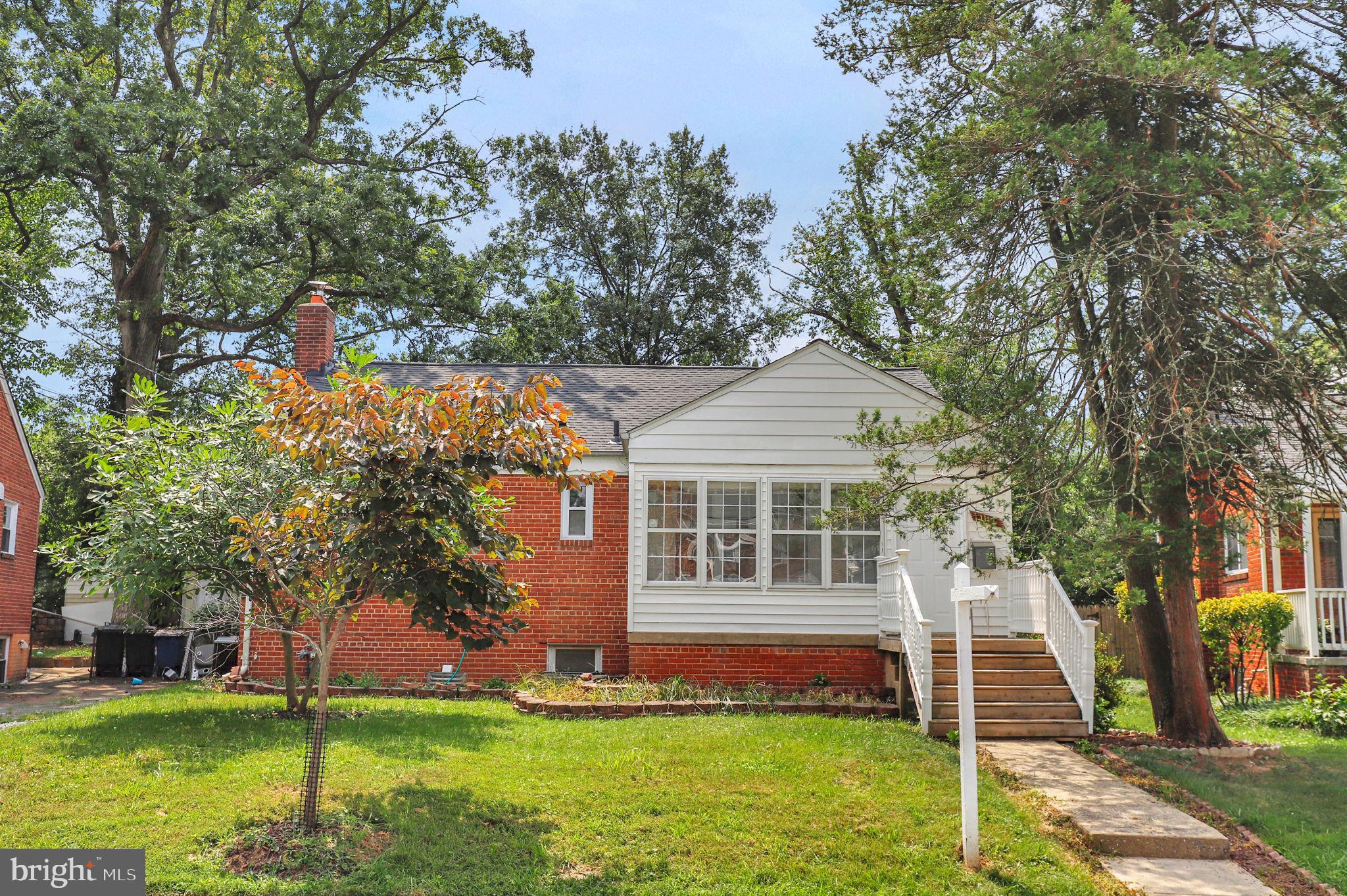***Open House Canceled due to illness***Priced for a quick sale, this charming ranch home features hardwood floors throughout the main level and LVP flooring in the finished walkout basement, which includes a bedroom and a full bath. The property's recent upgrades include a new roof (2020), a new deck (2025), and a new water heater (2023). Enjoy the spacious fenced yard with fruit trees and an enclosed front porch that adds living space. This lovely home is conveniently located near the purple line and all major transportation routes.