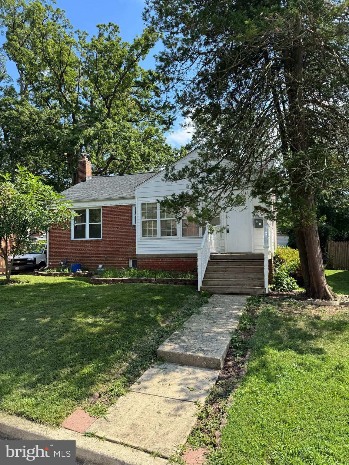 Priced for a quick sale, this charming ranch home features hardwood floors throughout the main level and LVP flooring in the finished walkout basement, which includes a bedroom and a full bath. The property's recent upgrades include a new roof (2020), a new deck (2025), and a new water heater (2023). Enjoy the spacious fenced yard with fruit trees and an enclosed front porch that adds living space. This lovely home is conveniently located near the purple line and all major transportation routes.
