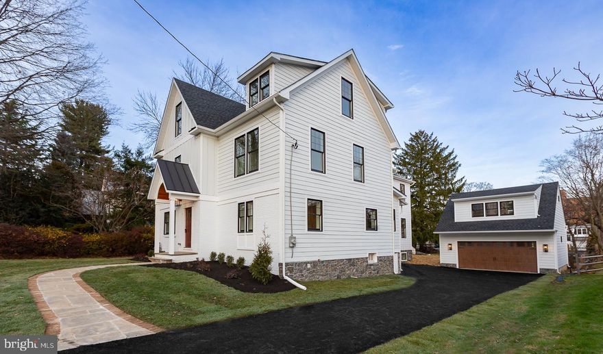 Exquisite, sophisticated & top of the line.  111 Banbury Way has been a labor of love, boasting custom finishes, pristine design & has everything going for it.  Walk-to Wayne location, square footage, up to 6 bedrooms if needed, 7 full baths & complete versatility in its floor plan/offerings.  Pull up & immediately fall in love with the Craftsman style exterior of this once Cape Cod, turned stately Colonial with James Hardie plank cement siding, standing seam roofing detail, stone foundation on both the home & the carriage house, gorgeous lantern fixtures, the fresh new driveway, covered entry with Tigerwood bead-board detail, black high efficiency Anderson windows & 30 year architectural roofing shingles.  A completely maintenance free exterior.  This stunning home has been re-built & expanded ground up- 4 stories.  The flow of the main level has everything you’ll need & want.  White oak flooring spans the entire floor plan for a clean & cohesive feel.  Included is a living room with pine wall detail & wood burning fireplace insert, formal dining room with wet bar to include cabinets and tiled backsplash, gorgeous home office (or a first floor bedroom if desired), magnificent kitchen & great room concept, a mudroom entry for out back access, a butler's pantry with wet bar & custom cabinetry & a full bathroom.  The kitchen is absolutely stunning.  Craftsman style cabinets, some glass front, open shelving, custom lighting, a huge center island with microwave & beverage fridge, built-in pantry wall, quartz countertops, backsplash, coffee nook banquette & room for a breakfast table.  GE Monogram appliances, all top of the line.  The openness of the great room is perfect for everyday living & entertaining guests.  The gas fireplace with Carrara marble surround & Craftsman style mantle is the perfect centerpiece.  Large windows throughout this space, the back stair leading up to the primary suite & side door for convenience.  The full bath is perfectly located off the butlers pantry.  The tile-work, features & fixtures of every space on the first floor are so special.  The 2nd floor offers a huge primary suite with vaulted ceiling, exceptional lighting choices, white oak flooring, 2 large walk-in closets & a spectacular full bath.  Take the back stairs off the kitchen for a shorter trip to your bedroom!  2 additional bedrooms on the second floor, both with gorgeous full baths, large custom closets & white oak floors as well.  The light rail is so fun in the front bedroom!  The laundry room with cabinetry is perfectly located in the 2nd floor hallway.  Head up to the 3rd floor where you will find 2 amazing bedrooms & another perfect full bath.  The lower level of the home offers exceptional space.  A custom gas fireplace, the white oak floors & ample natural light make this room great for all of your needs.  In addition to the finished space, the original basement offers you a ton of extra storage space, work out space, a full bathroom, utility room and a 2nd area to do laundry!  No expense was spared here!  The entire home has spray foam insulation, high efficiency HVAC-5 Zones, high efficiency tankless water heater, 2 high efficiency gas fireplaces & a wood burning fireplace.  The natural light that flows throughout this home on all floors is something you need to see.  Large windows, one of a kind tile & lighting details, the craftsman style woodwork carried throughout the home.  All of these things make it so special.  The carriage home/garage is an exceptional added space!  Au pair, in-laws, older children, etc.  A large finished room and a full bathroom upstairs with its own mini split unit for heating and cooling.  The large garage with high end insulated premium garage door for efficiency.  The property is level and perfect in size.  The brand new driveway will fit many cars.  All new landscaping and bluestone & brick walkway out front.  This home offers such a great walk-to downtown Wayne location.