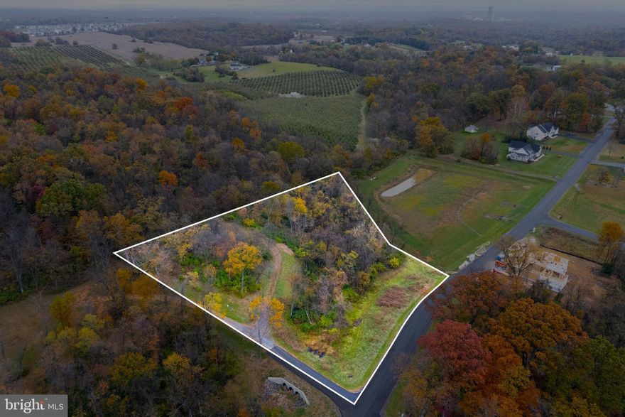 Build Your Dream Home at Evans Run – Lot 9 Welcome to Evans Run, one of Martinsburg’s most desirable communities for new construction. Situated on 2.51 acres, Lot 9 offers the perfect blend of space, privacy, and natural beauty—ready for your custom home. This expansive homesite is nestled among completed and occupied properties, ensuring an established neighborhood setting while still offering the excitement of a new build opportunity. With a valid perc test and surrounded by homes on well and septic, this lot provides a seamless path toward building your ideal residence. The gently rolling terrain and partially wooded backdrop offer the perfect canvas for a private backyard oasis, while scenic mountain views and the tranquil setting capture the essence of West Virginia living. Whether you’re looking to build now or secure land for the future, Lot 9 at Evans Run delivers space, scenery, and opportunity in one of Berkeley County’s most sought-after communities.