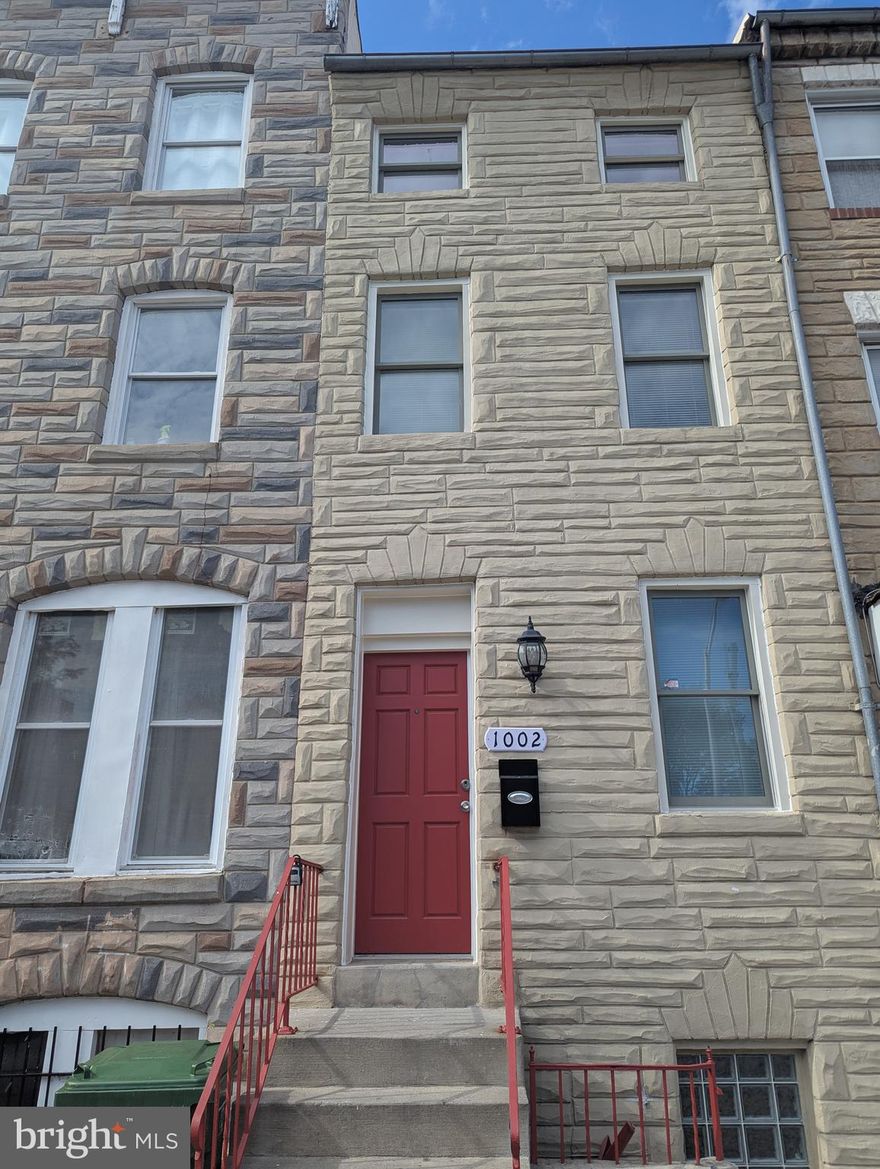 Welcome to the incredible Hollins Market neighborhood and gorgeous 1002 W Lombard St. Throughout the home you'll find charm and multiple updates. Come inside and be blown away by the 3 levels of exposed brick and sundrenched spaces that exude historic Baltimore. The first floor greets you with a living room that offers an open concept and a cozy fireplace, while the updated kitchen boasts new appliances, and incredible flow into the spacious dining area. Make your way upstairs to the 2nd floor that offers 2 spacious bedrooms, and a full bathroom. The 3rd floor features 2 additional bedrooms and another full bathroom. Don't miss the unfinished basement that can be used for storage, or finish it for additional living area! A convenient location, just blocks from multiple parks and seconds to downtown.