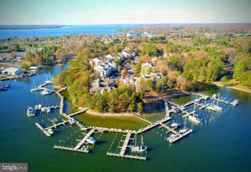 ABSOLUTELY BEAUTIFUL! with the most sq footage available in the community in a 2BR 2FB unit. Lovingly cared for by the same owners for the previous 12 years. Resort style living! Open floor plan, eat in kitchen w/island, gas cooking and a trash compactor.. Fantastic deck w/ walkway to the sitting area ( see pics ). Boat slip #N-9 conveys with the property, located where the Patuxent River meets the Chesapeake Bay. Unit owners can also crab/crab pots right from the pier! 2 drop off parking spots, designated for the pier. Award winning Solomons Island gated community, pool, tennis courts, pickle ball, putting green, outside seating w/ gas fire place. The clubhouse has a well-appointed gym, meeting room, gathering room, kitchen, and bar. Plenty of quest parking. Elevator - 3rd floor access, Full size Washer/Dryer in unit, gas fire place, gas instant HWH, soaring cathedral ceilings. LOTS of large windows throughout for plenty of ambient light. SUPER efficient hydro gas heat system. Minutes from Solomos island - a short walk to restaurants, bars, museums and a beautiful boardwalk, boating, water craft rentals and a ton more to do. Close to PAX river base and shopping.