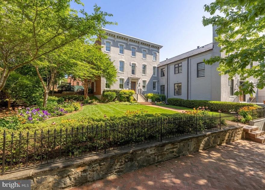 Price improvement! Welcome to 2715 N Street NW, a distinguished Georgetown residence set within the coveted East Village. Encompassing over 5,400 square feet of meticulously renovated living space, this 7 bedroom, 7.5 bath home presents a rare opportunity to experience refined modern luxury within a historic Washington setting. A defining feature of 2715 N Street NW is its expansive front garden—an uncommon offering in Georgetown—creating a gracious approach and an ideal setting for outdoor entertaining or quiet retreat. Inside, the home unfolds across multiple thoughtfully designed living areas, including elegant sitting rooms and a well-appointed butler’s kitchen, allowing for both intimate gatherings and large-scale entertaining. Throughout, the residence is finished with premium materials, state-of-the-art appliances, and a cohesive design that balances sophistication with comfort.

Additional conveniences include off-street parking and generous indoor-outdoor flow, enhancing both functionality and livability. Perfectly positioned just steps from Rose Park, M Street, and Wisconsin Avenue, the home provides immediate access to Georgetown’s finest dining, shopping, and cultural destinations. For those seeking a truly singular offering, the property may also be combined with the adjacent church conversion, home to three luxury residences, creating a rare and remarkable Georgetown compound. 2715 N Street NW represents an exceptional opportunity to own a residence of scale, elegance, and distinction in one of Washington’s most prestigious neighborhoods.