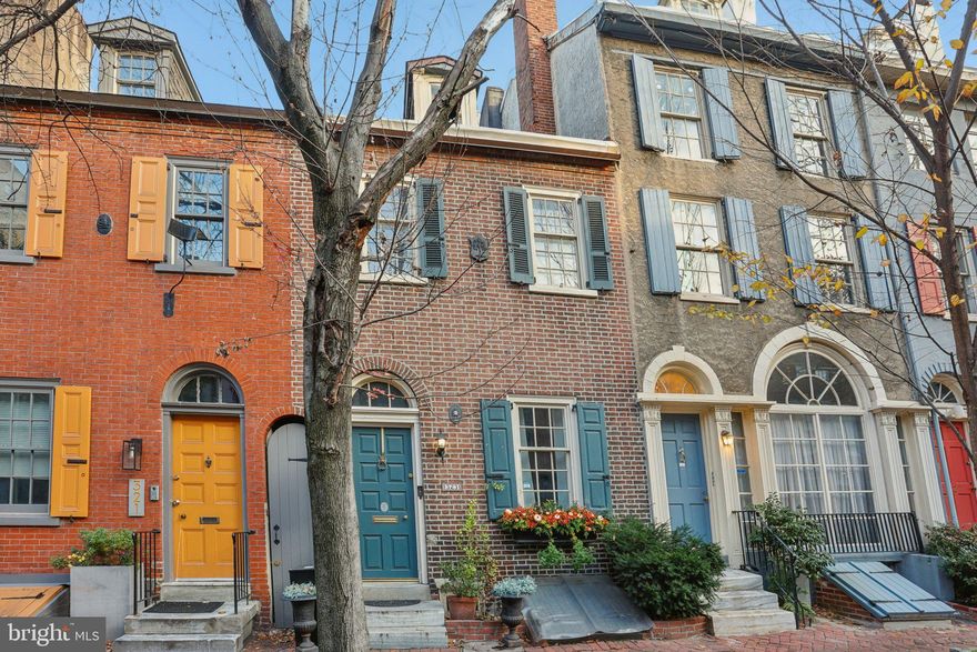 Introducing 323 South Camac Street, a rare offering on one of Washington Square West’s most admired and storybook streets. Surrounded by tree-lined blocks, neighborhood cafés, parks, and endless conveniences, this address places you at the center of one of Philadelphia’s most walkable and spirited communities. Inside, the home blends historic integrity with modern upgrades. The welcoming front living room showcases tall ceilings, abundant character, and the first of four fireplaces, all accentuated by the home’s newly refinished 225-year-old yellow pine floors—a remarkable original feature. The adjoining dining room offers another fireplace and a wide window that radiates natural light from the private courtyard. Beyond, the thoughtfully designed galley kitchen includes quartz countertops, stainless steel appliances, and charming built-in seating. Step through the French doors to a quiet brick courtyard, ideal for casual meals, unwinding outdoors, or hosting friends. The second floor offers two comfortable bedrooms, each with their own fireplace, and a full bath. The recently renovated third floor serves as a private retreat, complete with vaulted ceilings, generous closet space, an updated en-suite bath, and a balcony accessed through new French doors—a serene vantage point to enjoy city lights and treetop views. A bonus room on this level works beautifully as an office, studio, or fourth bedroom. The finished lower level adds additional living potential—perfect for hobbies, home fitness, play area, or additional storage if need.  The lower level also includes a powder room,  washer and dryer. Conveniently,  there is outside access to the street level.  Major improvements further enhance the home’s comfort and reliability: a new flat roof, upgraded electrical, and a new HVAC branch installed in 2025. The property also retains its original historic windows, adding to its authenticity. A shared alley between homes offers convenient outdoor storage, and an Amazon package lockbox provides for secure delivery. To top it off, the sellers will provide one year of prepaid parking at closing. Just steps from beloved neighborhood destinations such as Vetri Cucina, Habitat Coffee House,  Good Karma Cafe, Seger Park and Dog Park, Kahn Park, Whole Foods, and Acme.  There are multiple transit options for your convenience and just a 10 minute walk to Washington Square! This home offers an unmatched blend of location, character, and thoughtful updates. A truly distinctive residence on a cherished block—323 South Camac invites you to experience historic Philadelphia living at its finest.