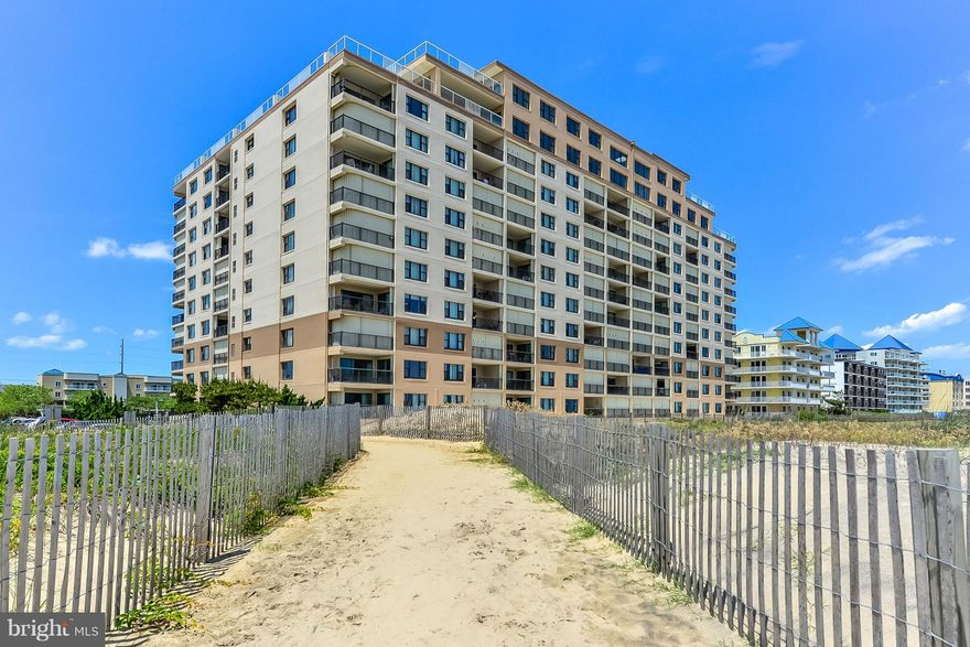 NEW LISTING! Recently  remodeled this lovely 2BR 2BA Oceanside unit features ocean views and an outdoor pool! This is an end unit and is bright and open with extra side windows! Updated kitchen with granite counters and counter seating. Additional features include new hardwood look laminate flooring, new Pella windows in 2016, updated baths, crown molding, ceiling fans, new washer and dryer in 2018, ceiling fans, updated furnishings, custom paint and shutters. You can relax on the wide, private balcony and watch the ocean or walk down to the beach or pool! This unit has 2 assigned parking spaces and there is extra guest parking. The condo association will be in installing a new storm doors and entry doors. This unit is easy to show and is a "Must See" Property!