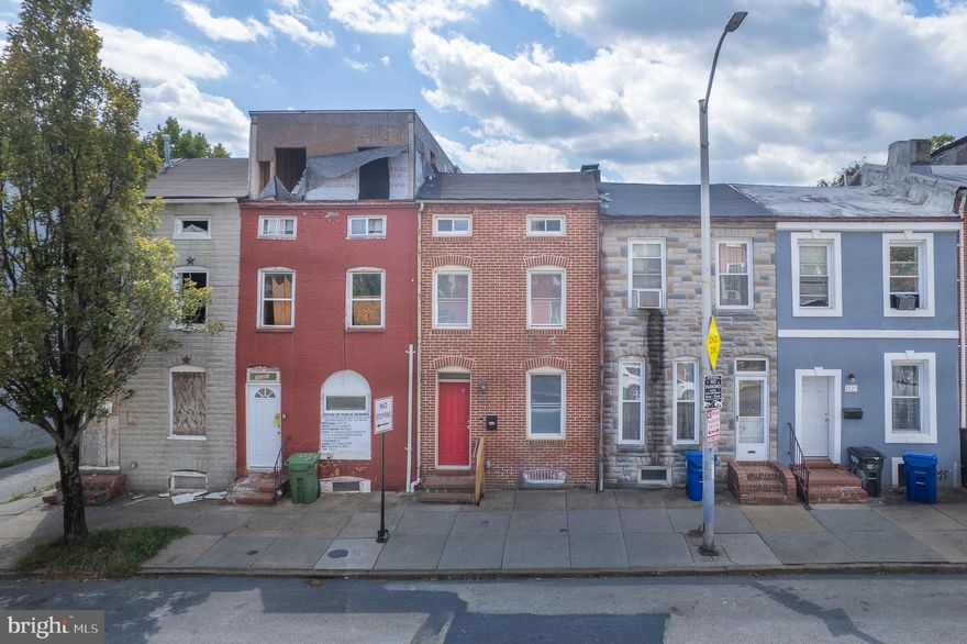 Welcome to this charming rowhome located at 1123 West Lombard Street in the vibrant Hollins Market neighborhood of Baltimore, MD. With its classic architecture, this home offers 2 spacious bedrooms and 2full bathrooms and a half bathroom, making it an ideal space for families or roommates. The property sits on an 871 square foot lot and includes a basement, offering potential for additional living space or storage. This home is perfect for those with a vision; its current condition presents a fantastic opportunity for investment as a rental property or a personal project. Situated near the University of Maryland and the bustling Medical Center, the location attracts a diverse community seeking convenient urban living. The surrounding area boasts easy access to public transportation, local eateries, and the famous Hollins Market, adding to its rental appeal. If you’re looking to invest in a property with great rental potential or create a personalized home, this could be the perfect choice for you. Don’t miss out on this enticing opportunity to own a piece of Baltimore’s rich history.