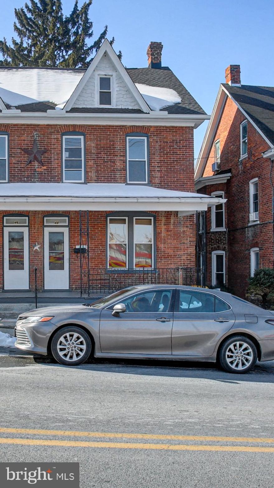 This updated brick 3-bedroom, 1-bath home offers the perfect blend of classic charm and modern improvements. Major updates include a new roof, new vinyl windows, new 200-amp electric panel and wiring, and a new heat pump with oil back-up and central air. Hardwood floors have been freshly sanded and refinished, with mostly all new lighting throughout, plus partial updates to the kitchen and bath. Dishwasher, microwave and washer/dryer are new, some of the kitchen cabinets were replaced as well as granite countertops added. The home features a full attic and basement with potential for additional finished space, covered porches, and a single garage. Conveniently located within easy walking distance to Historic Downtown Waynesboro, offering dining, boutiques, art galleries, breweries, antique shops, community events, and more. Professional pics will be uploaded on 2/14.