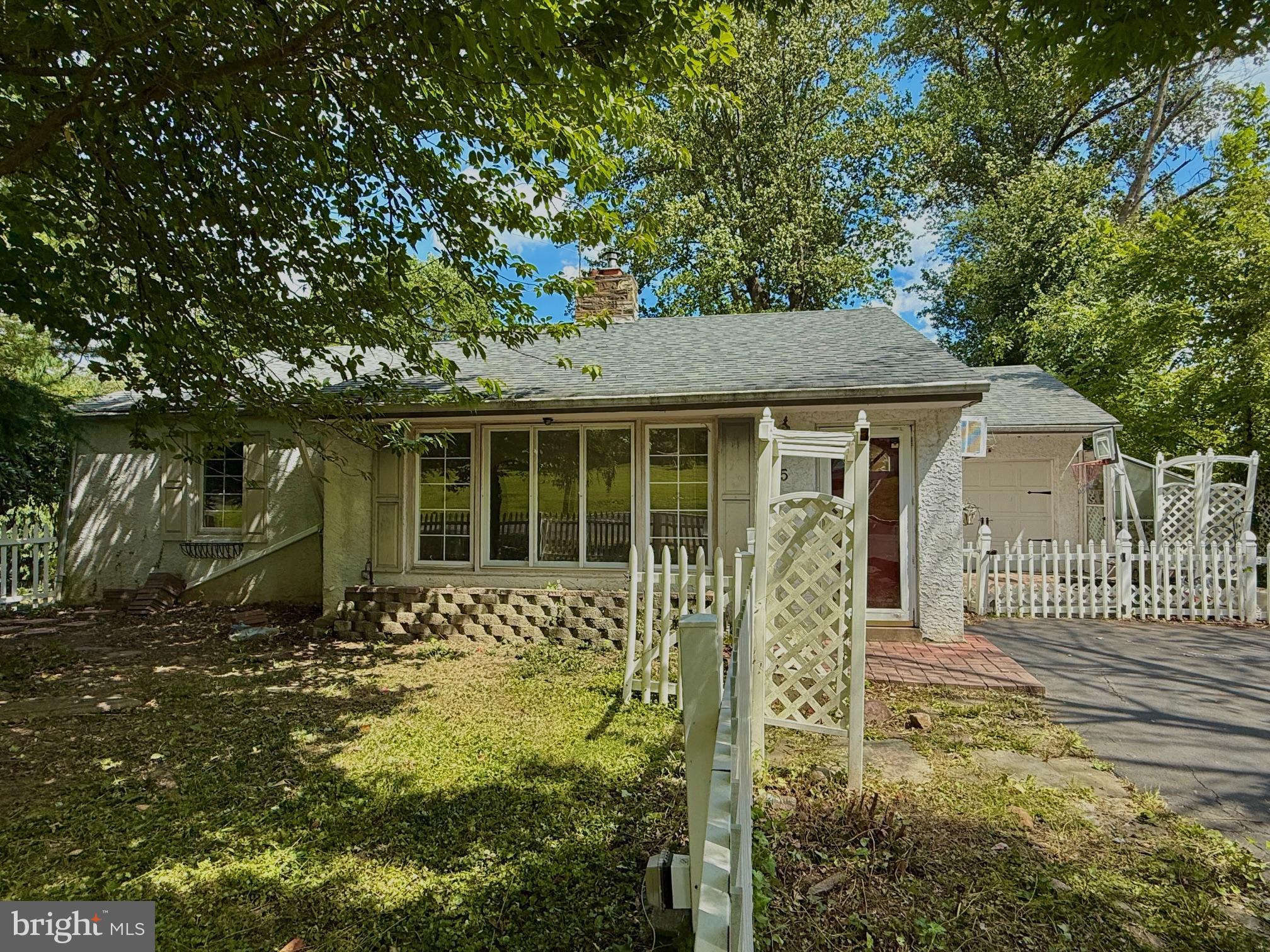 This single-story ranch in Feasterville-Trevose delivers 3 bedrooms, 1 full bath and 1 three-quarter bath, anchored by a bright living room with hardwood floors and a wood-burning fireplace insert. An open dining area with airy ceilings and great natural light connects to a functional kitchen with plenty of cabinetry. The primary bedroom offers two closets, and the additional bedrooms flex for guests or a home office. Downstairs, a full unfinished walkout basement with a bonus room is ready for future living space, gym, or storage. Outside, a large rear deck overlooks a partially fenced backyard, plus there’s a storage shed and a one-car garage. Two fireplaces (wood and gas) add warmth and character. Convenient Bucks County location with quick access to everyday amenities and major roadways. The home needs updating—ideal for an investor or owner-occupant to customize and build equity.